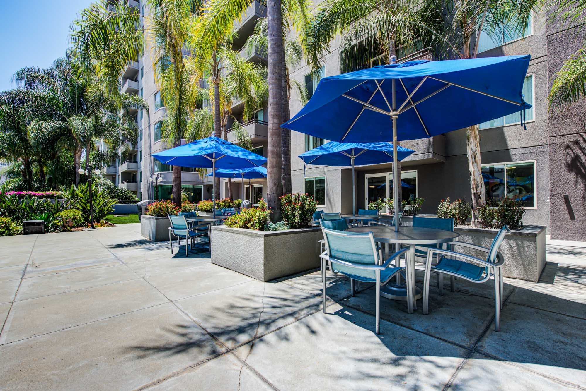 Outdoor seating with umbrellas at The Met in downtown LA