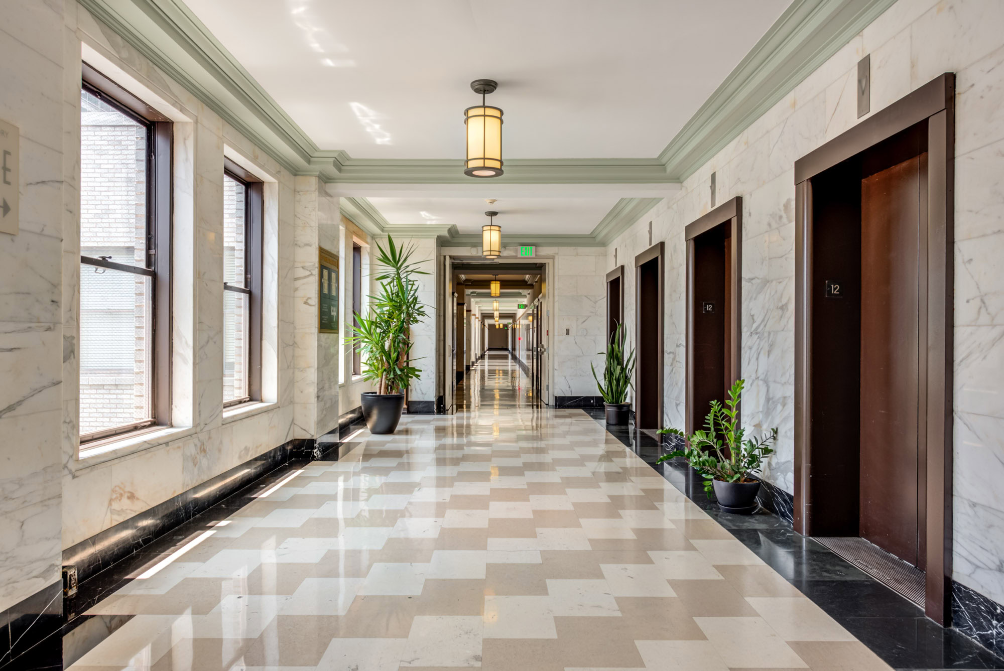 An art deco themed, grand Hallway at Metro 417's modern apartment in downtown LA