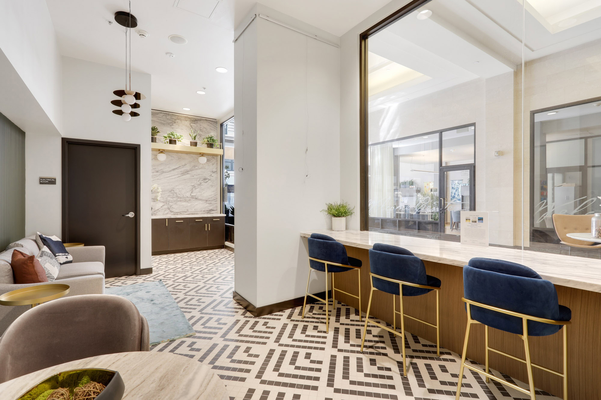 A modern lobby entrance seating and dining area at Metro 417's luxury apartments in downtown LA