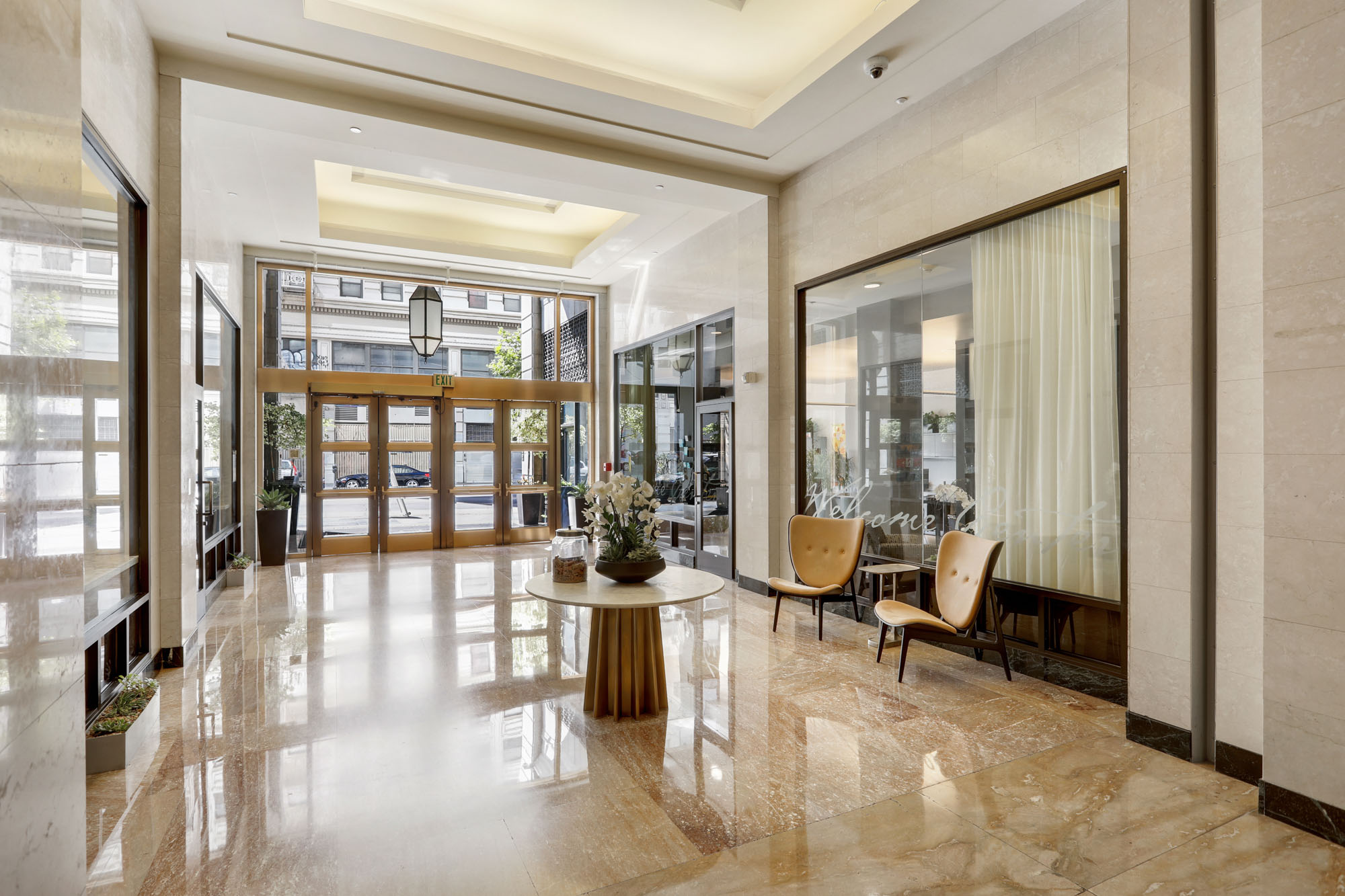 The lobby hallway leading to the exit of Metro 417's modern apartment building in downtown LA