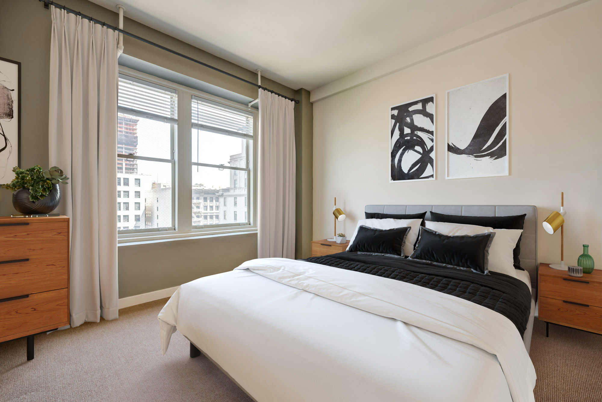 A bedroom with two windows and carpet flooring at Metro 417 in downtown LA