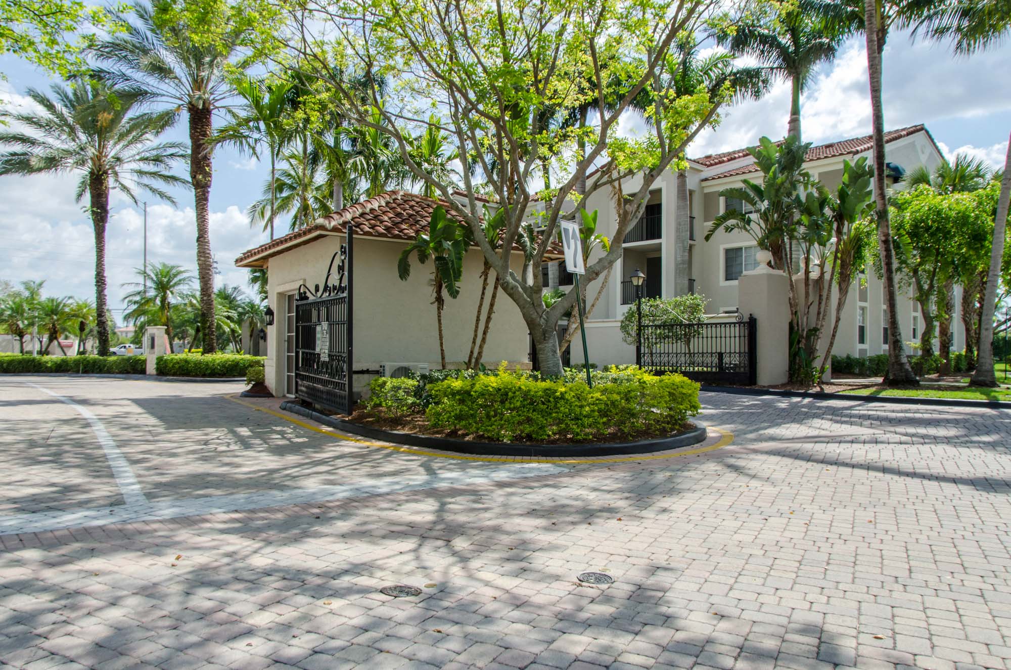 The entrance in front of the leasing center at Miramar Lake apartments in Fort Lauderdale, FL.