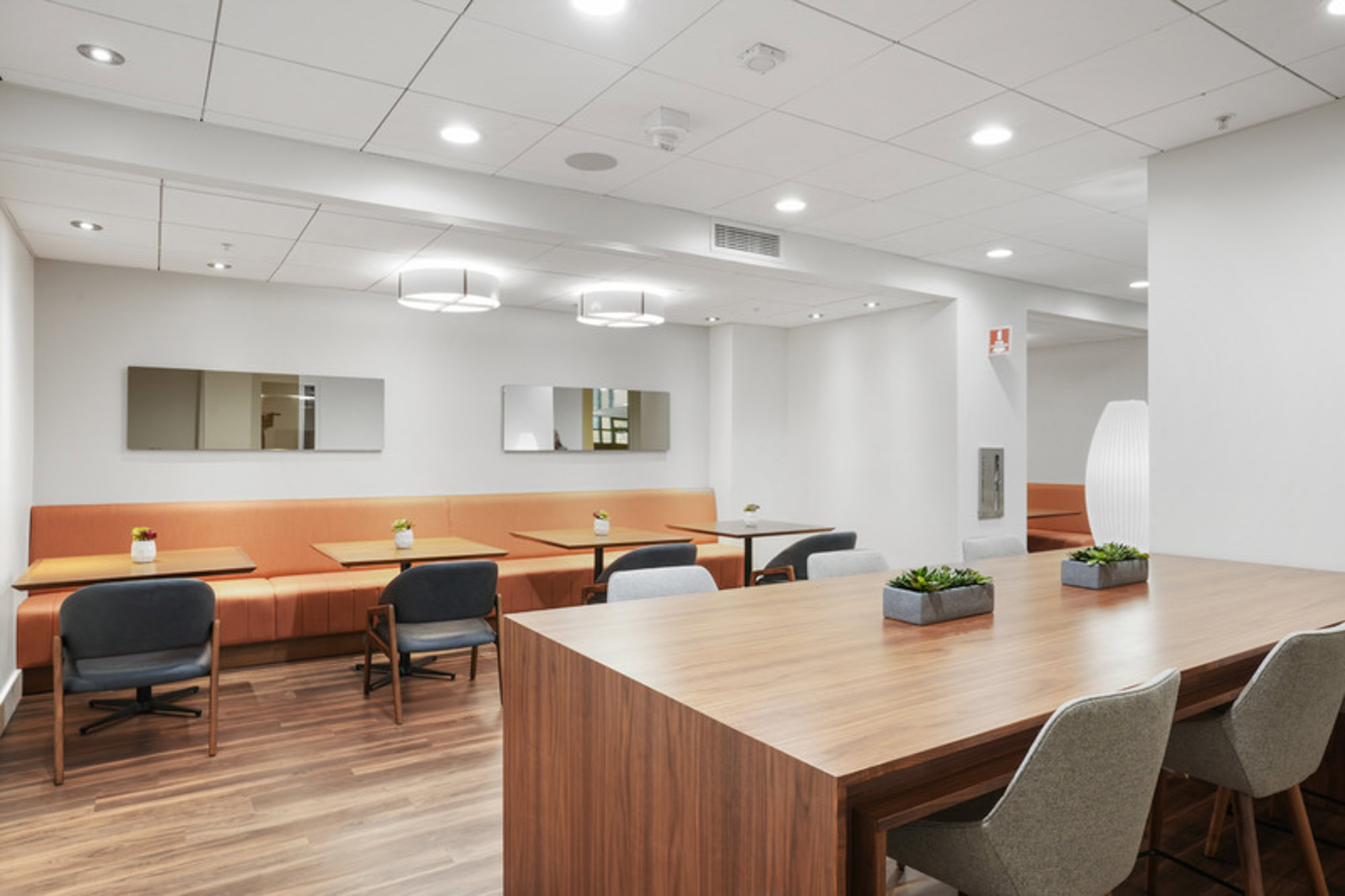 A community lounge with several seating areas at the Mosso apartments in San Francisco