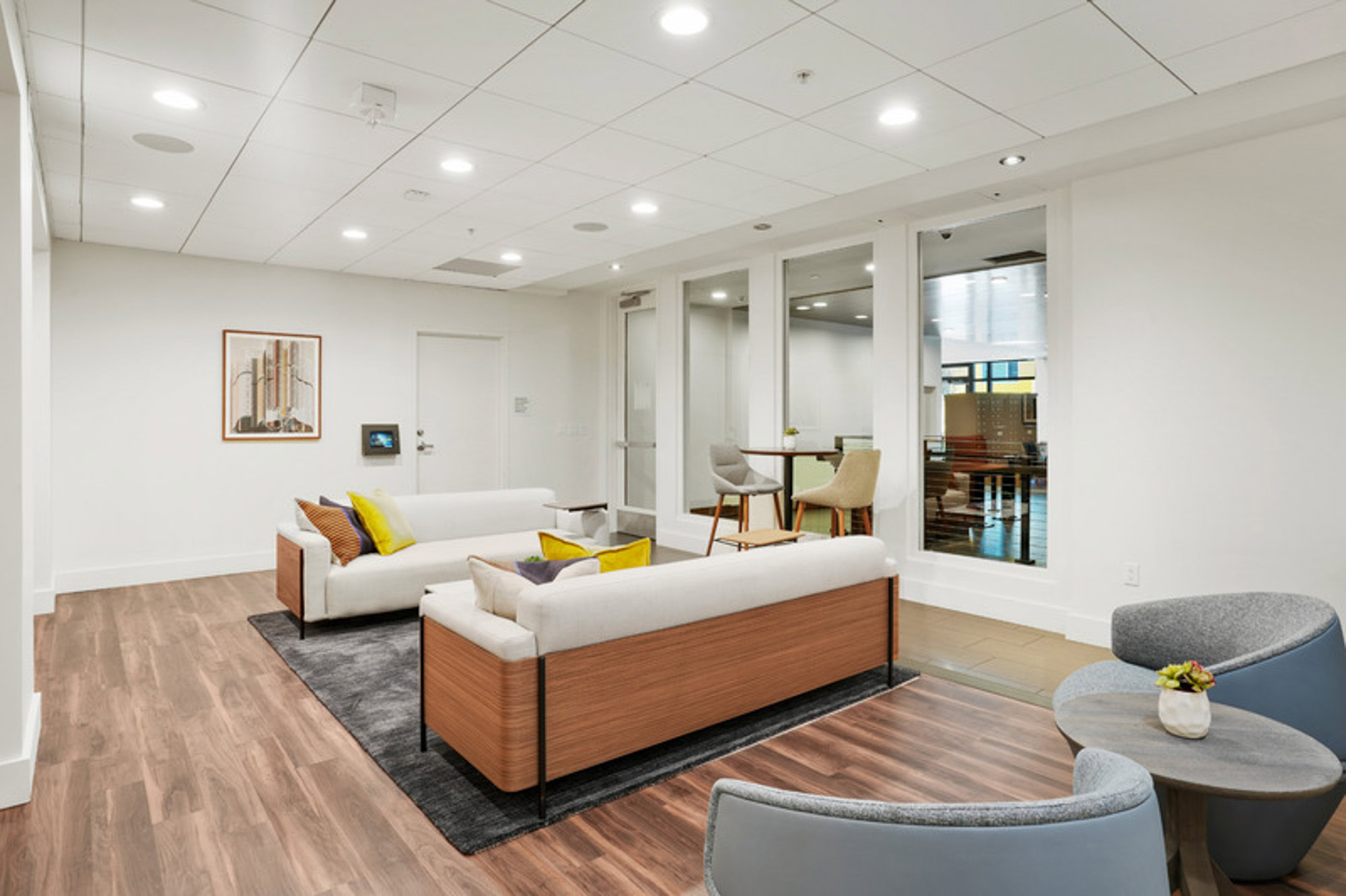 A community room with lounging chairs at the Mosso apartments in downtown San Francisco
