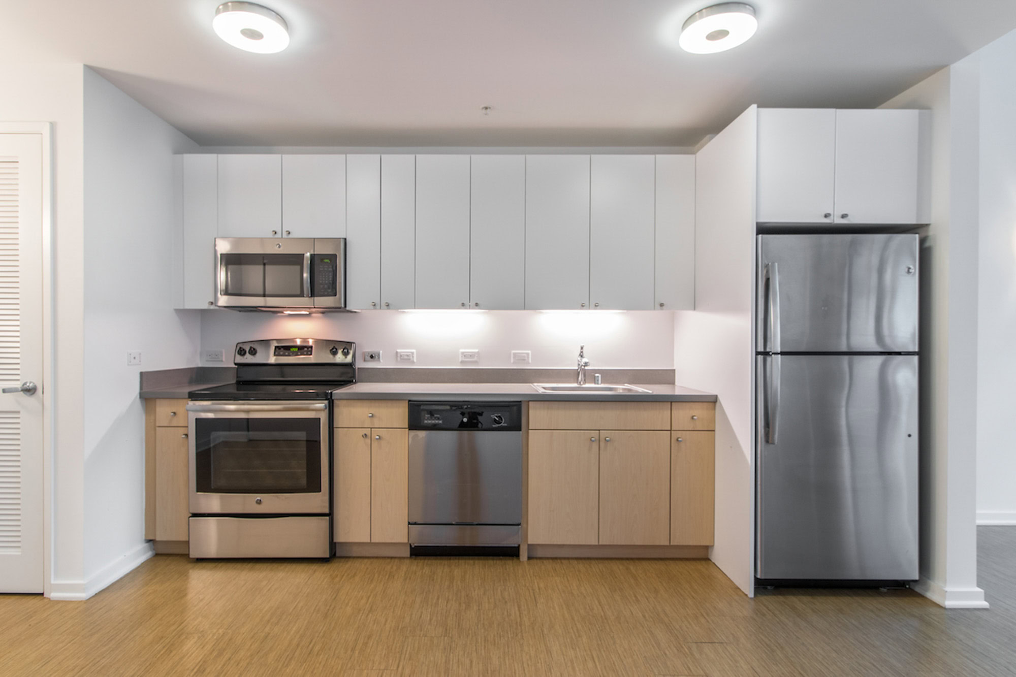 A kitchen in an open plan Mosso apartment in San Francisco
