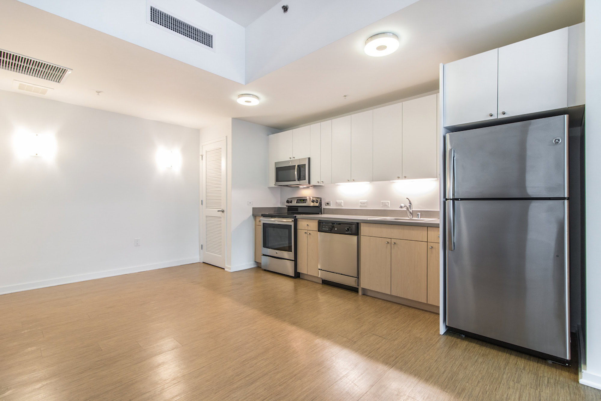 A kitchen in an open plan apartment in a Mosso apartment in San Francisco