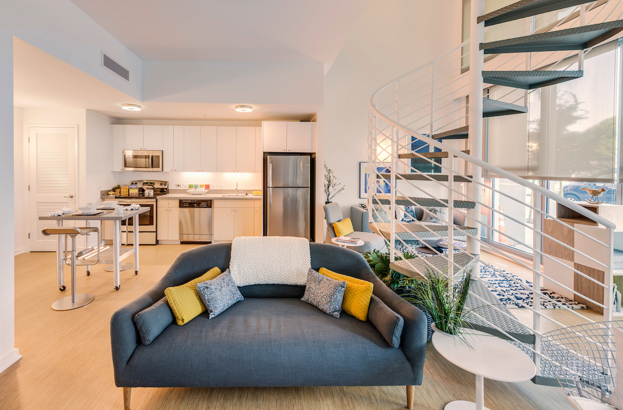 An open plan apartment with spiral staircase at Mosso apartments in San Francisco