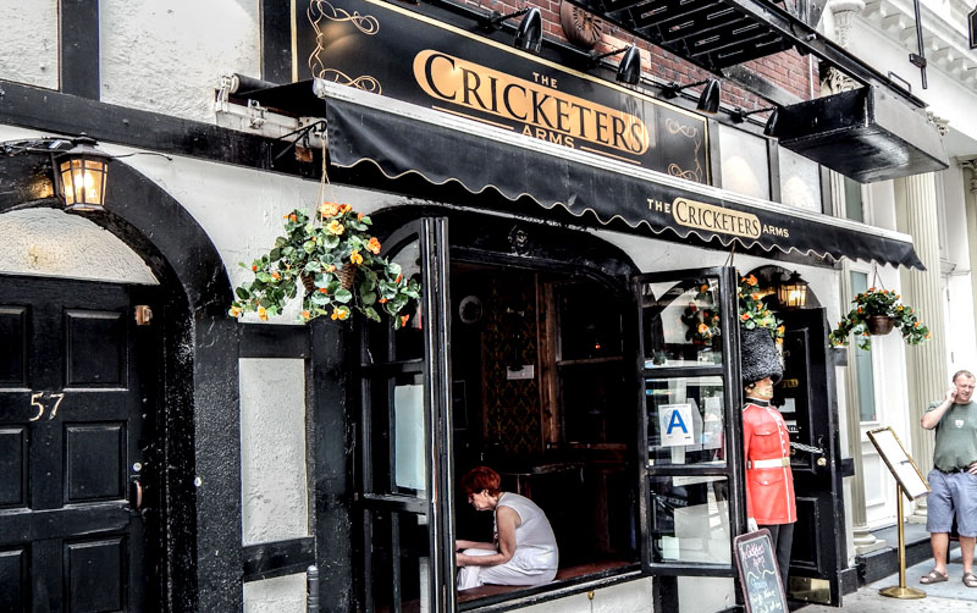 The storefront for The Cricketers Arms by 111 Worth apartments in New York, NY.