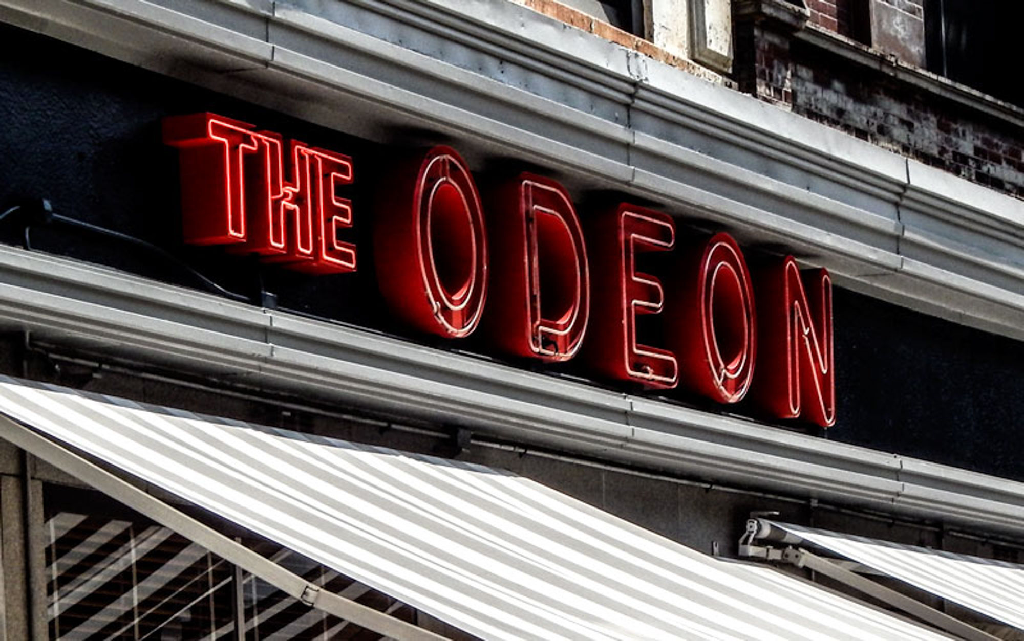 The sign for The Odeon by 111 Worth apartments in New York, NY.