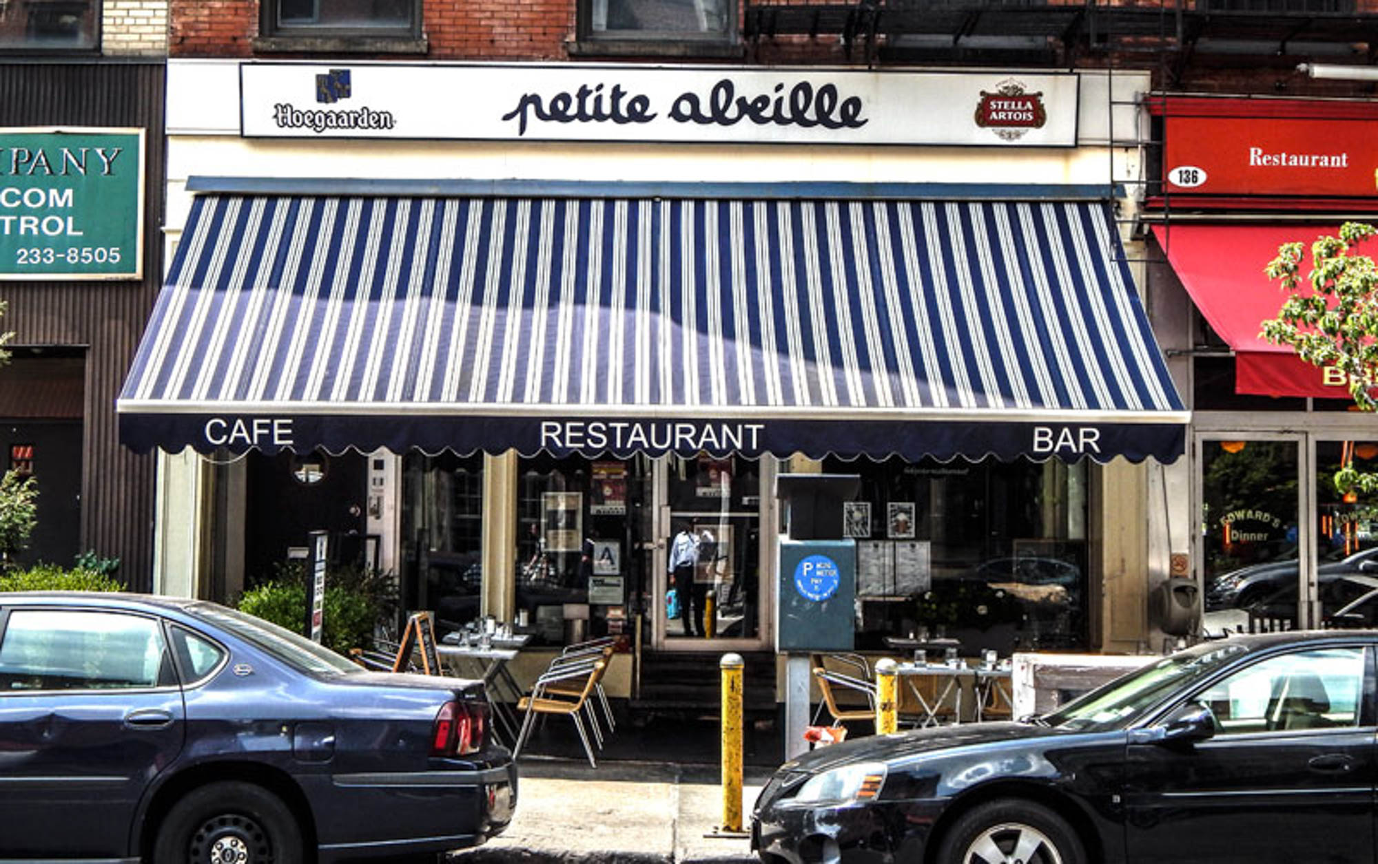 The storefront of Petite Abeille by 111 Worth apartments in New York, NY.