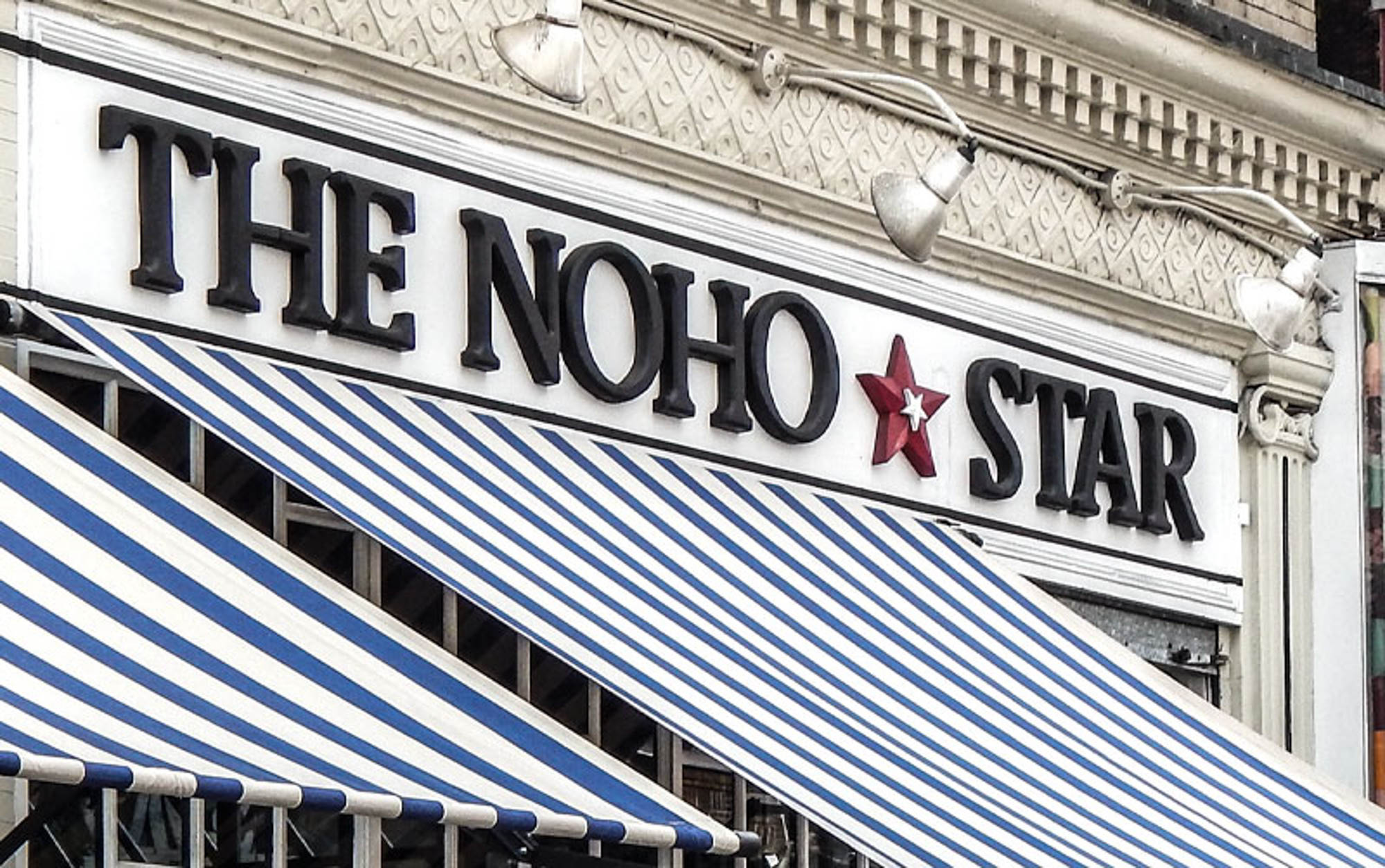 The sign for The Noho Star by 111 Worth apartments in New York, NY.