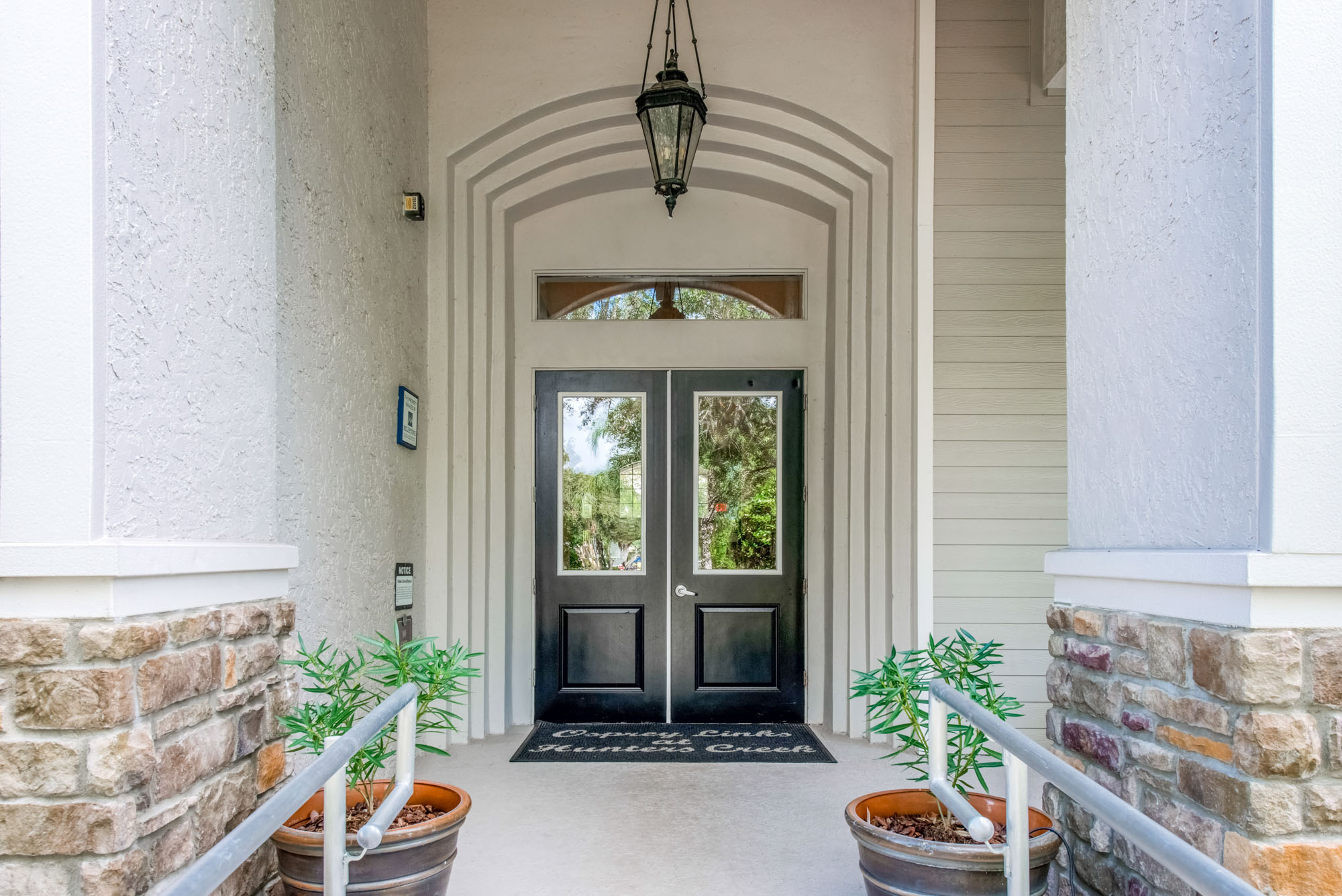 The front doors clubhouse at Osprey Links at Hunter's Creek apartments in Orlando, Florida.