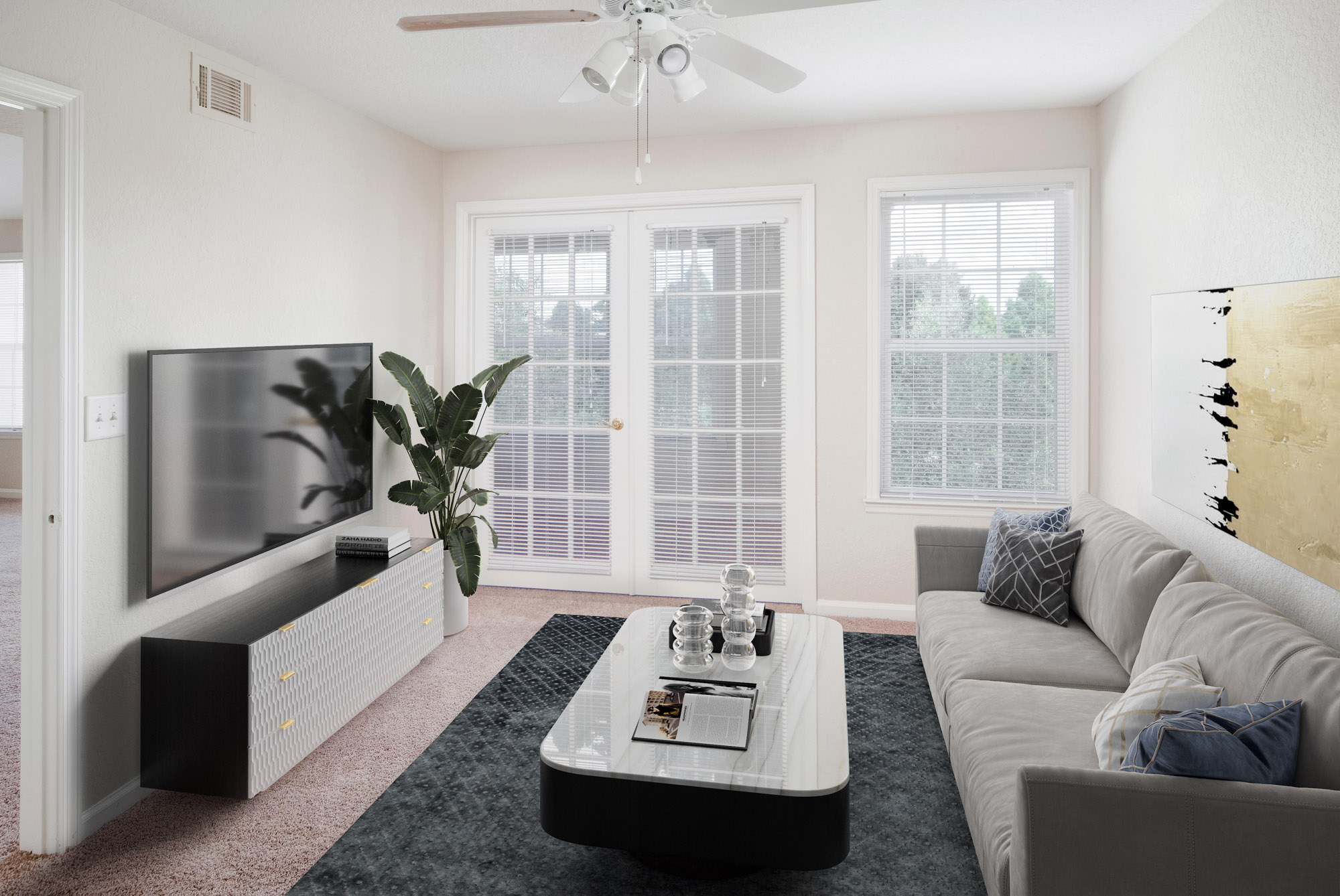 A carpeted living area in an apartment at Osprey Links at Hunter's Creek in Orlando, Florida.