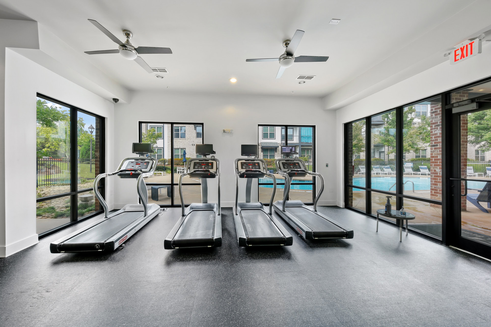 A fitness center with cardio equipment at Park 9 apartments in Woodstock, GA