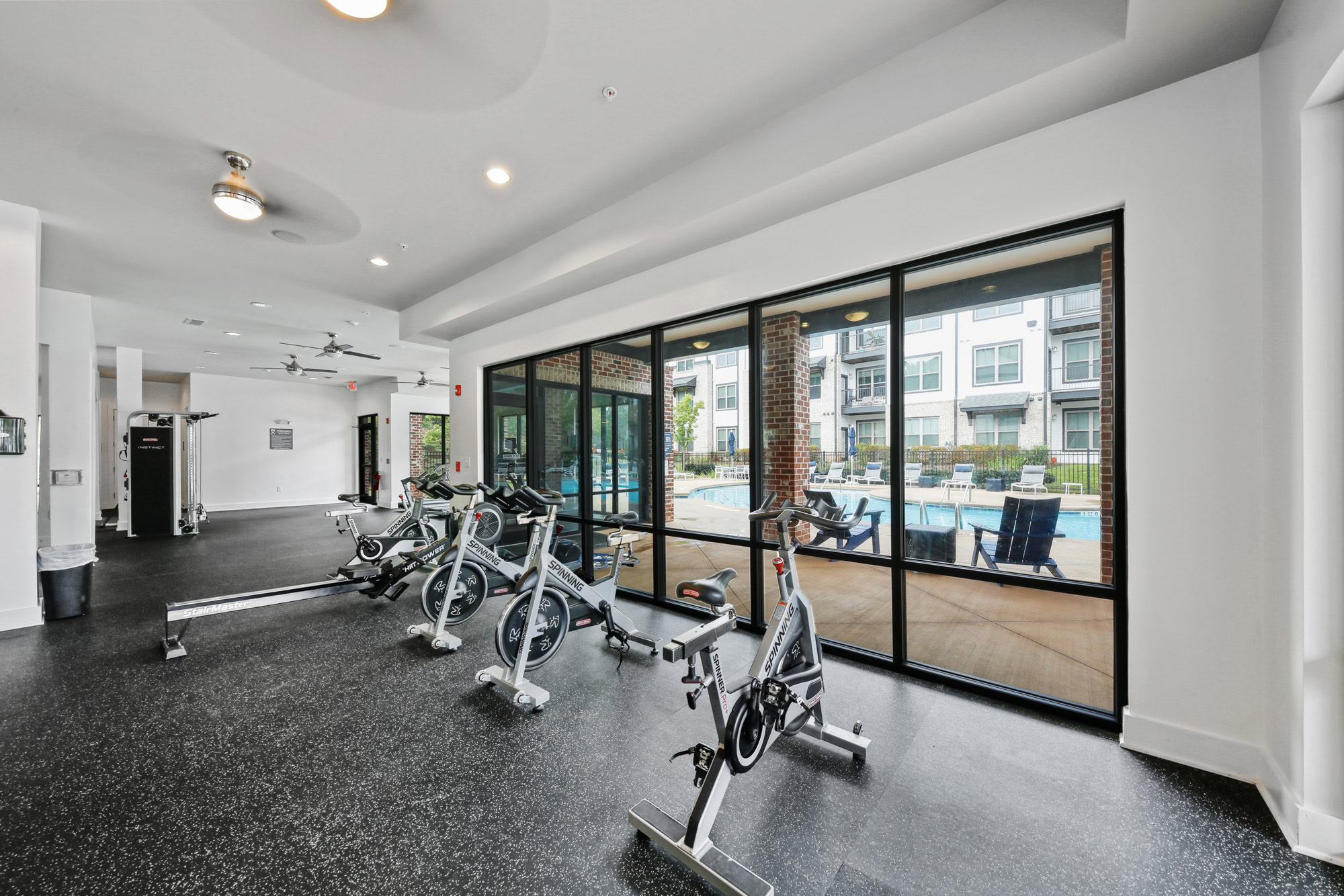 A fitness center with cardio equipment at Park 9 apartments in Woodstock, GA