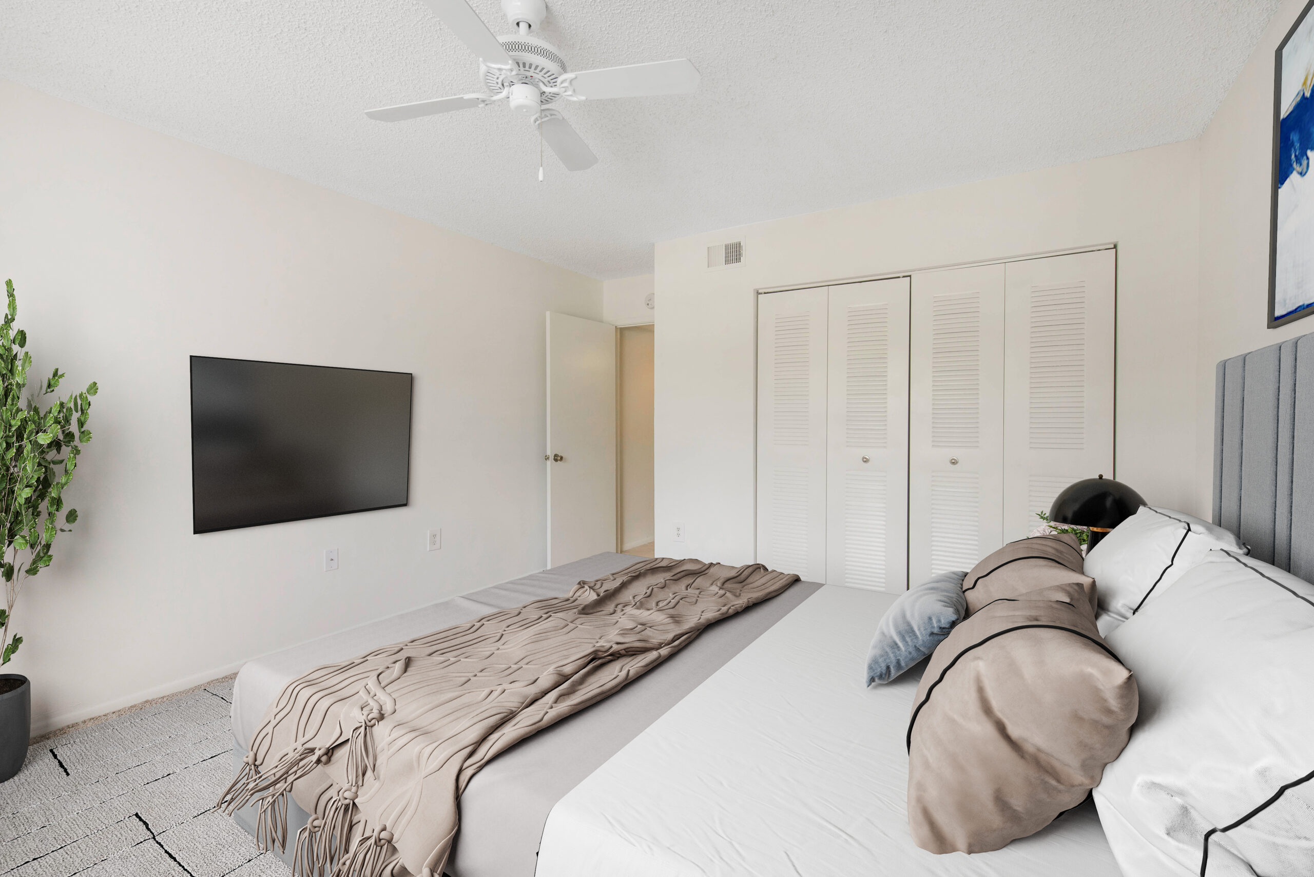 A bedroom at Sabal Pointe apartments in South Florida