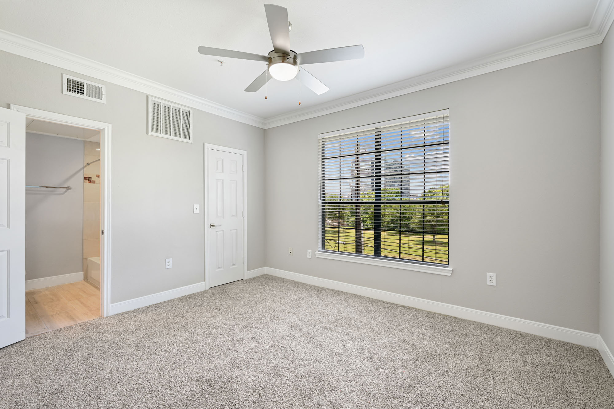 The bedroom in a Village on Memorial townhouse in Houston, TX.