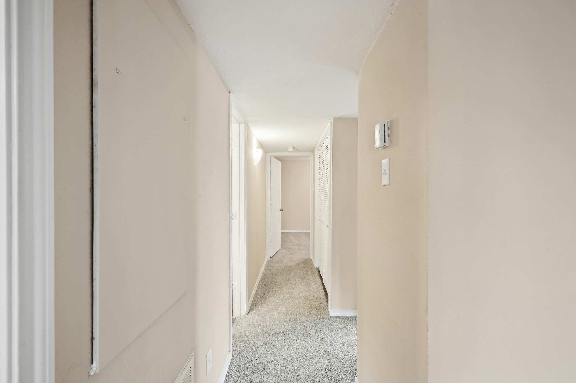 The hallway at Lake Village West apartments in Garland, TX.