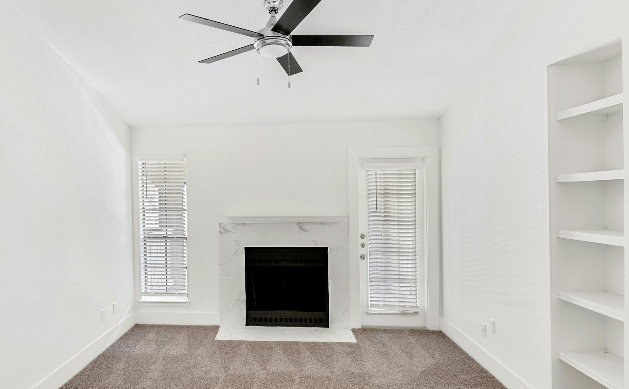 The living area of an apartment at The Arbors of Wells Branch in Austin, TX.