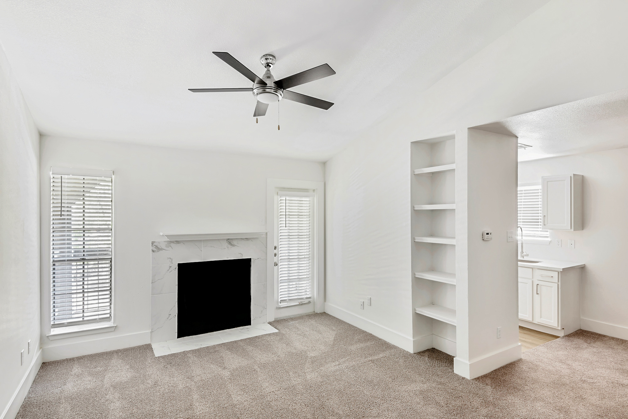 The living area of an apartment at The Arbors of Wells Branch in Austin, TX.