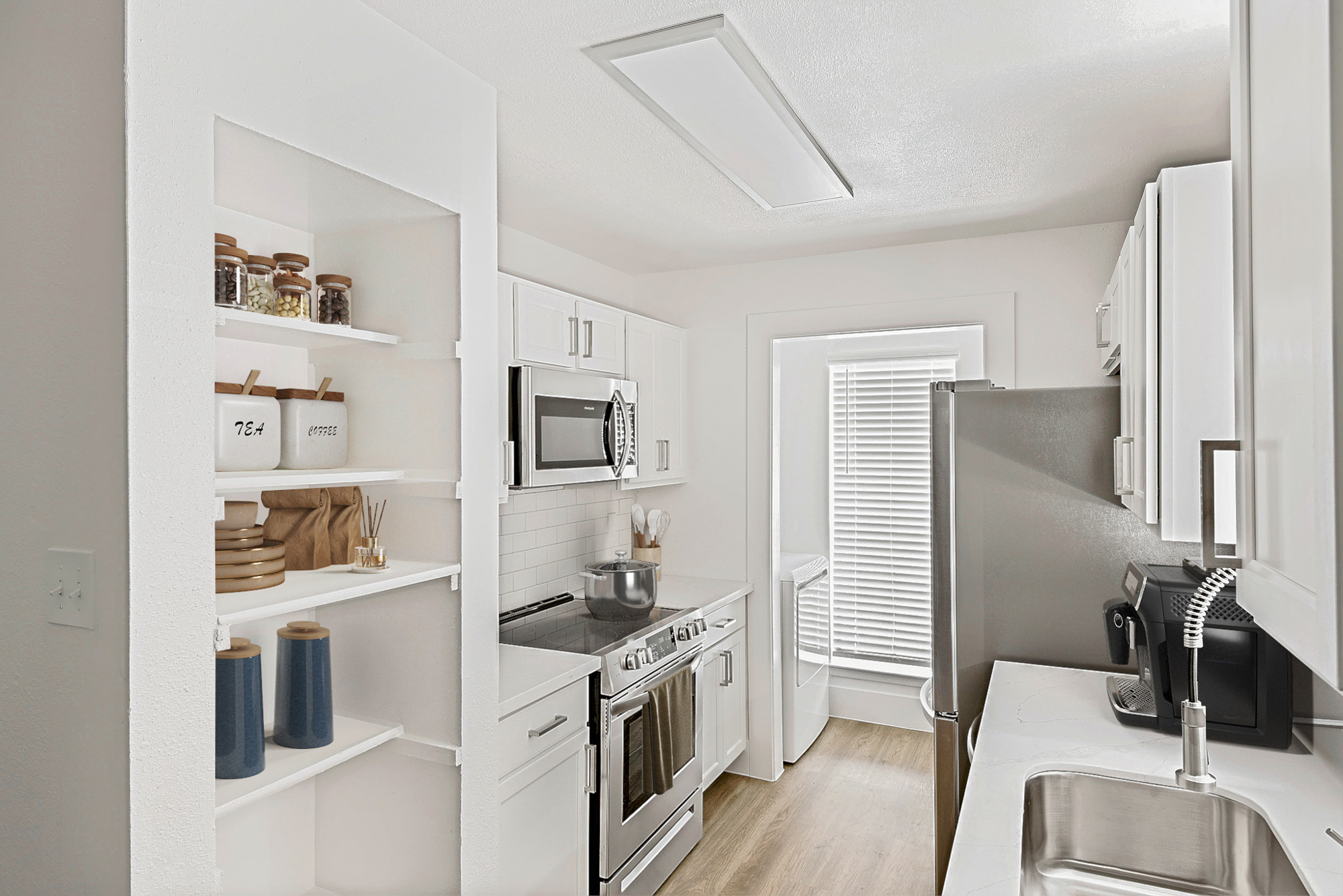 The kitchen of an apartment at The Arbors of Wells Branch in Austin, TX.