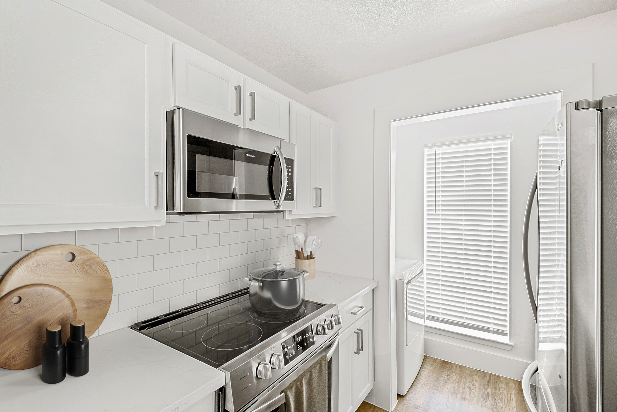 The kitchen of an apartment at The Arbors of Wells Branch in Austin, TX.