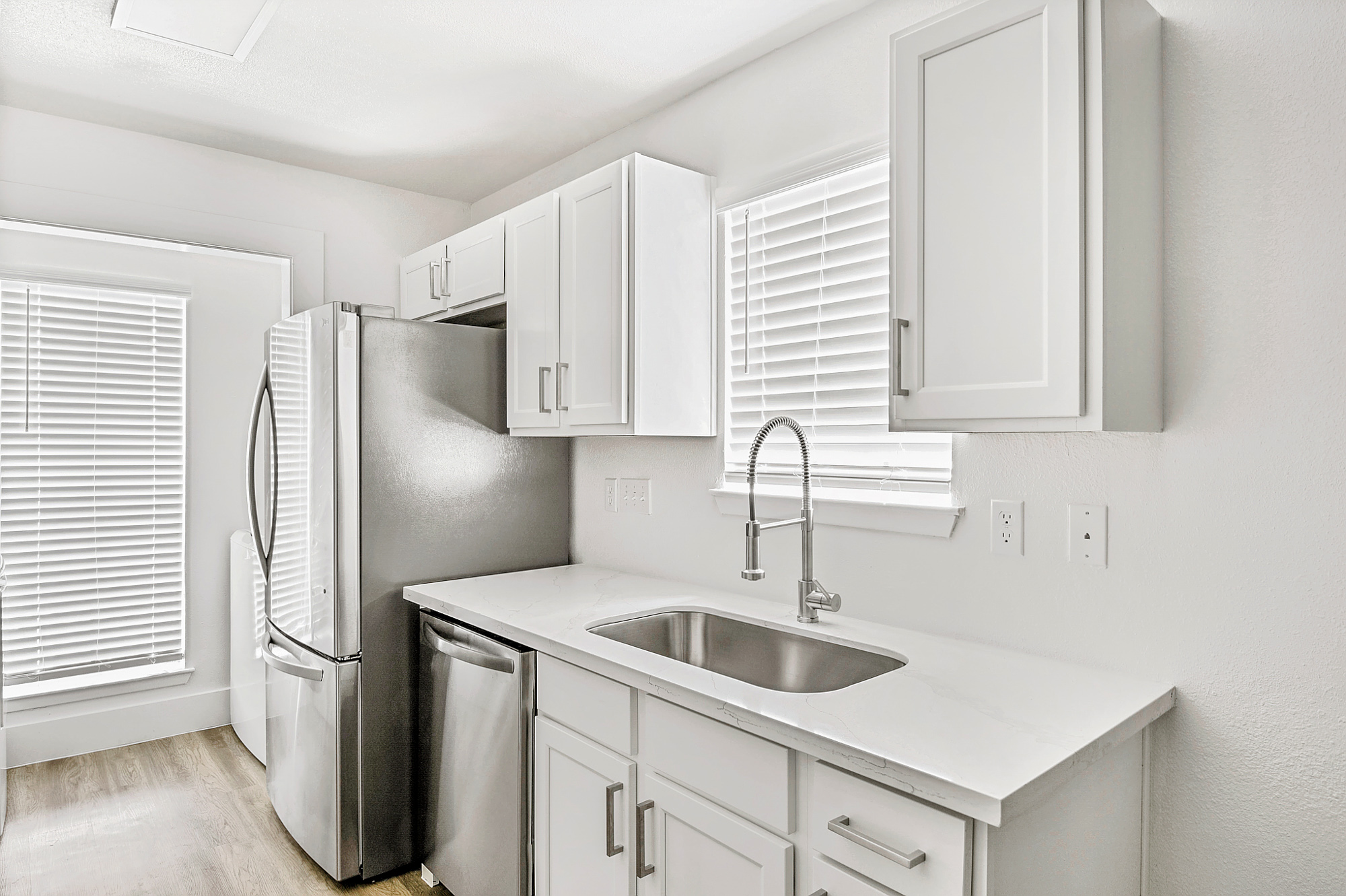 The kitchen of an apartment at The Arbors of Wells Branch in Austin, TX.