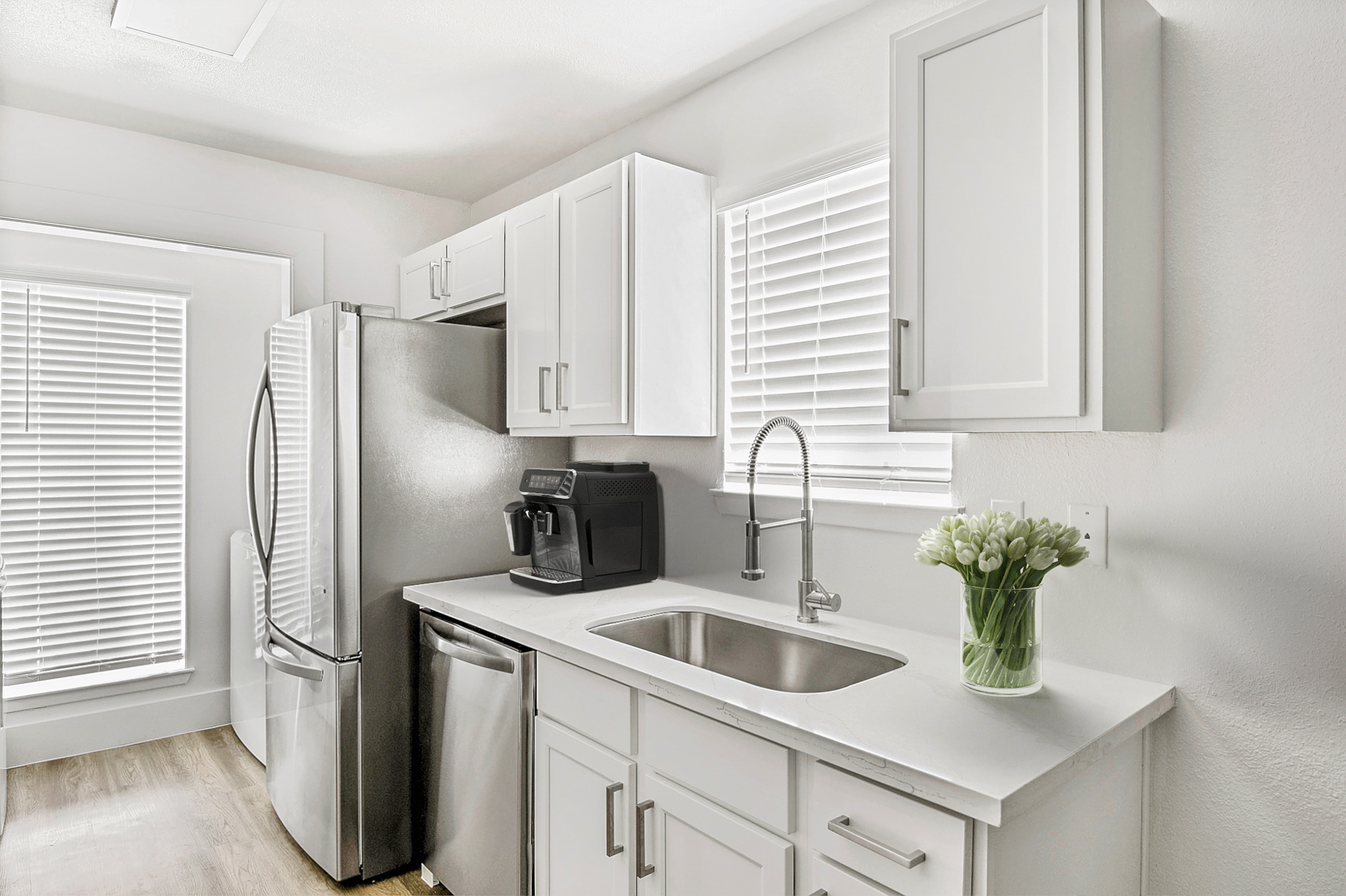 The kitchen of an apartment at The Arbors of Wells Branch in Austin, TX.