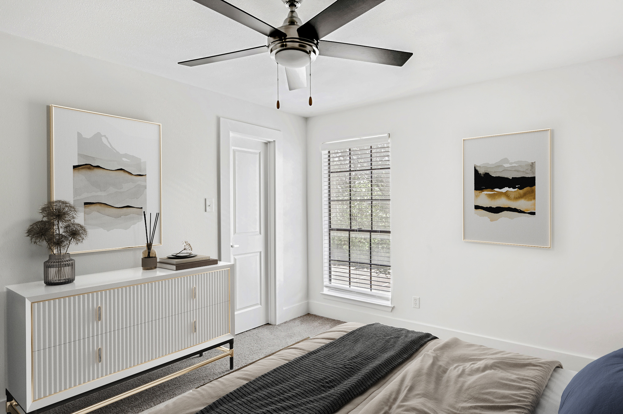 The bedroom of an apartment at The Arbors of Wells Branch in Austin, TX.