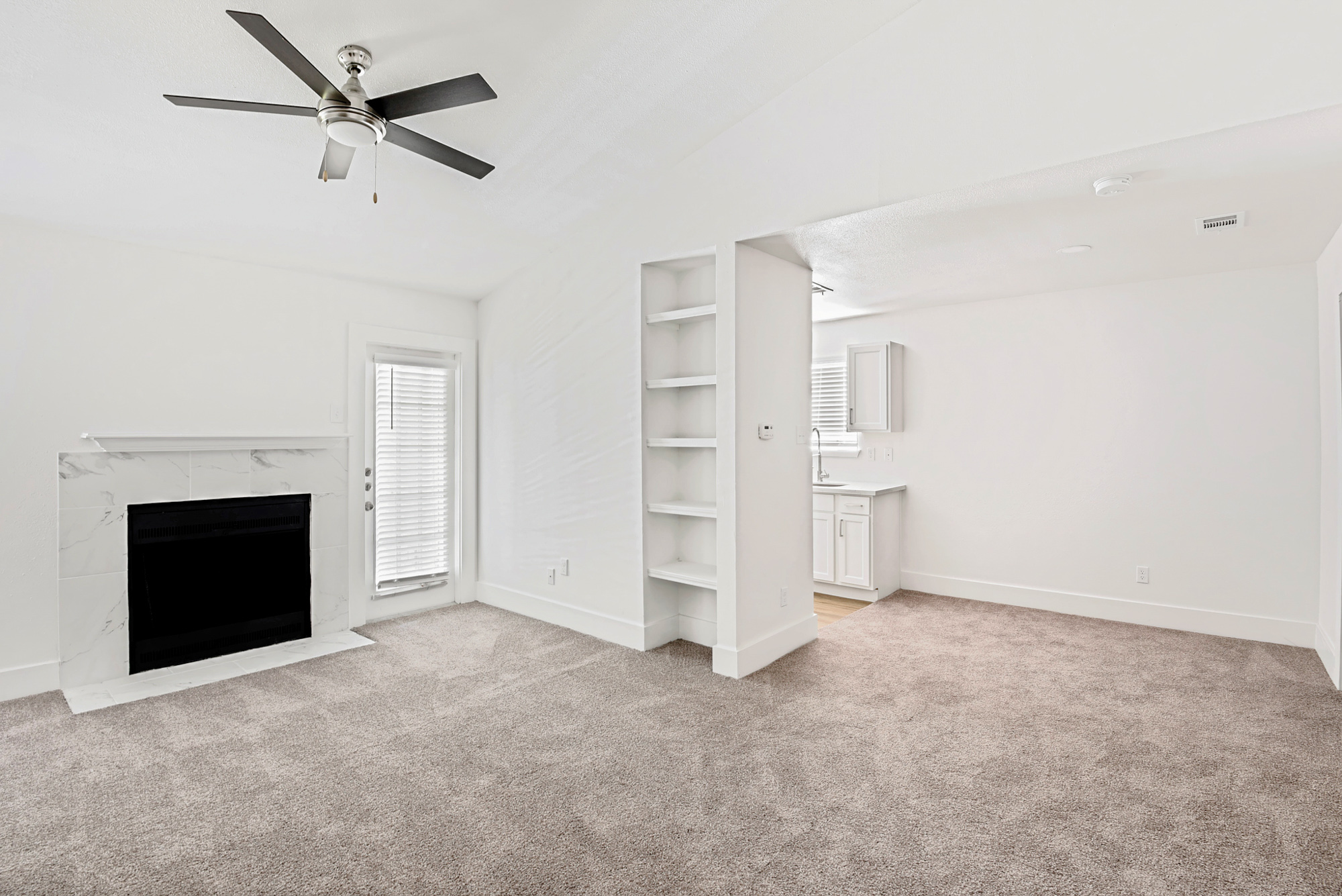 The living area of an apartment at The Arbors of Wells Branch in Austin, TX.