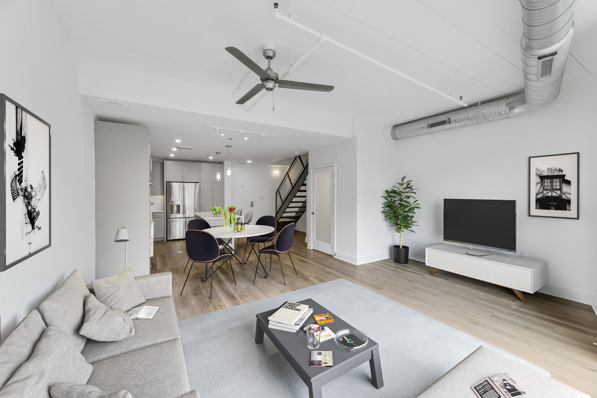 The living room and dining area in a Foundry Lofts apartment in Washington, D.C.