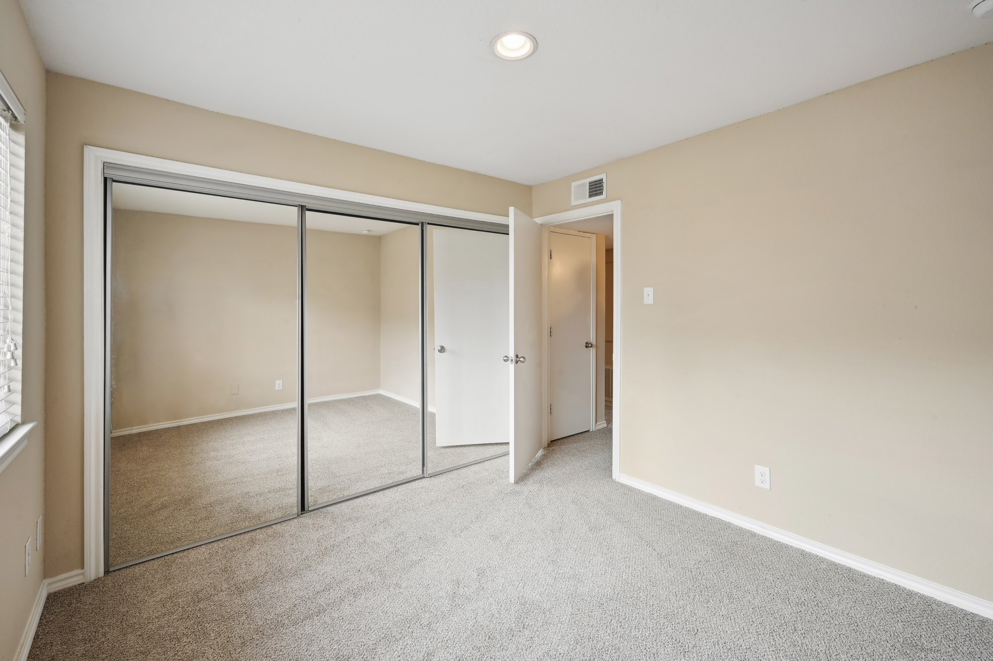 The bedroom at Lake Village West apartments in Garland, TX.