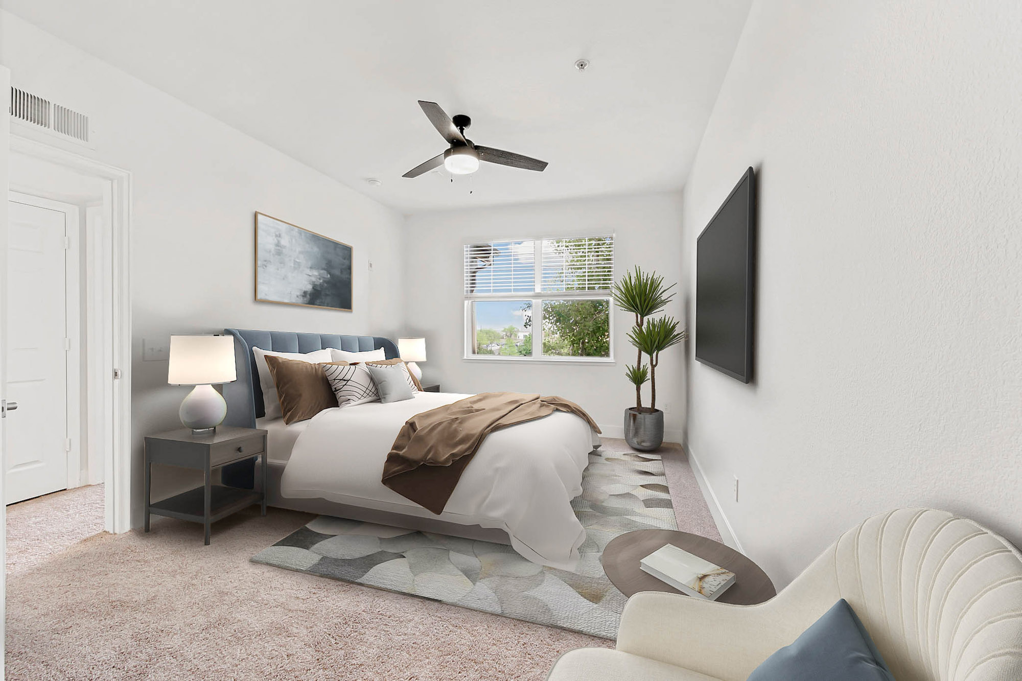 A bedroom in an apartment at The Village at Legacy Ridge near Denver, Colorado.