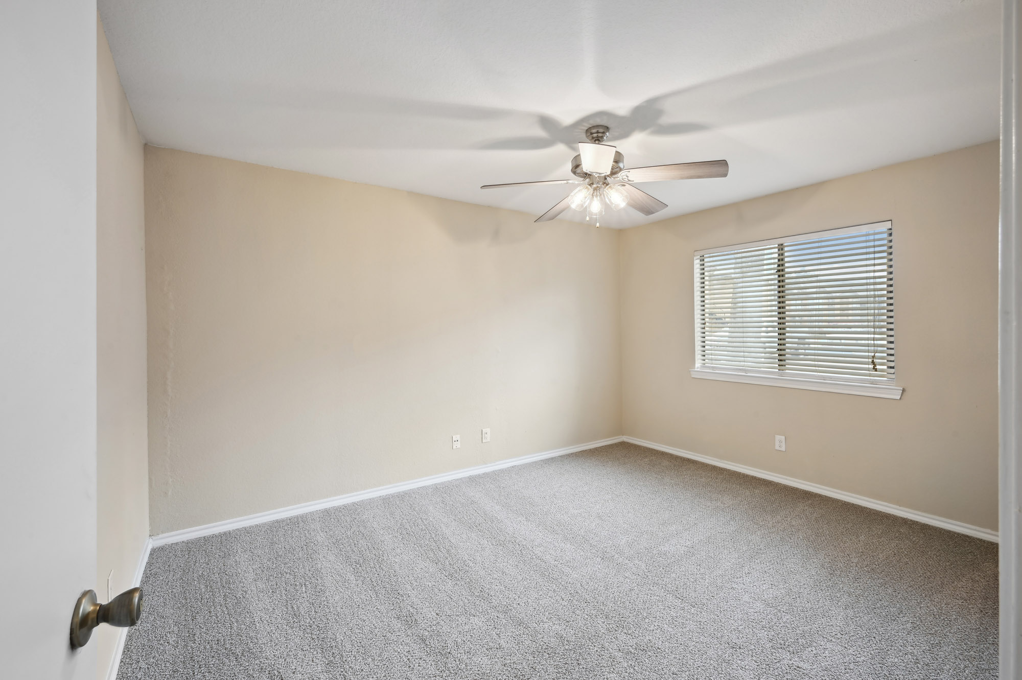 The bedroom at Lake Village West apartments in Garland, TX.