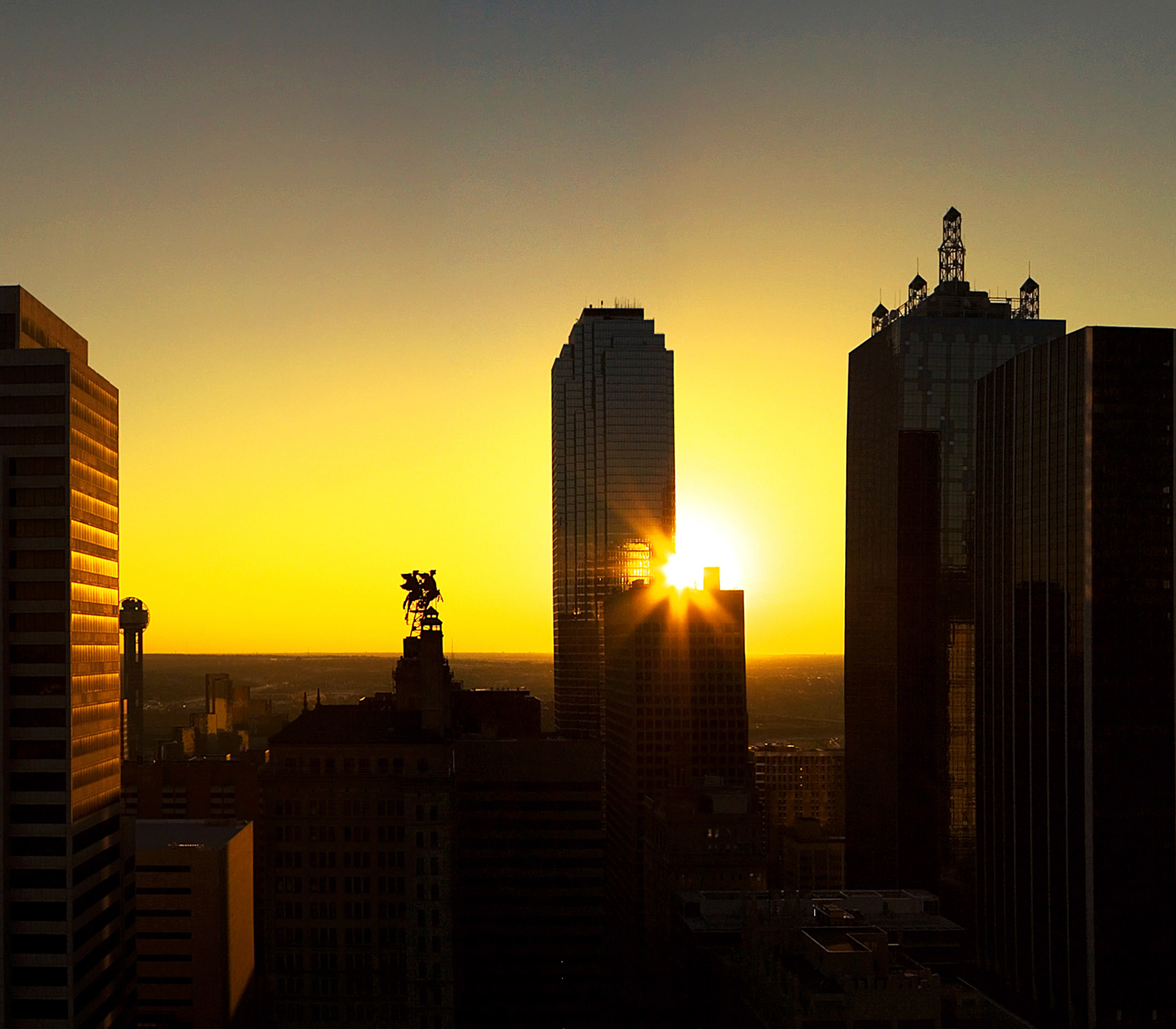 Dallas, TX city view at sunset near The Element apartments building