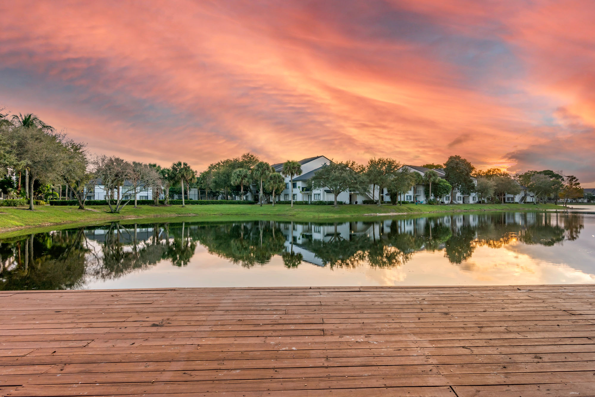 There are buildings on the water at The Reserve at Ashley Lake apartments for rent in Boynton Beach