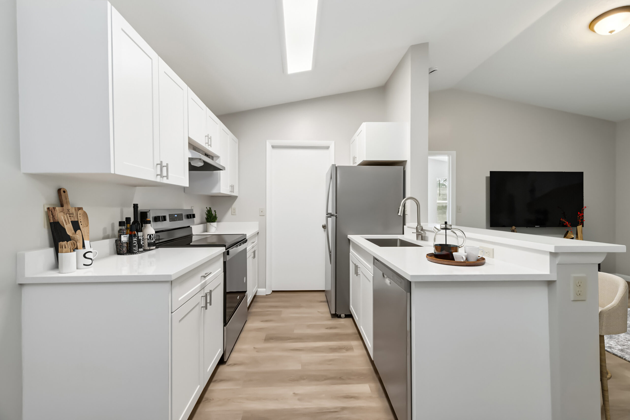A galley kitchen at the Turtle Cove apartments for rent in West Palm Beach