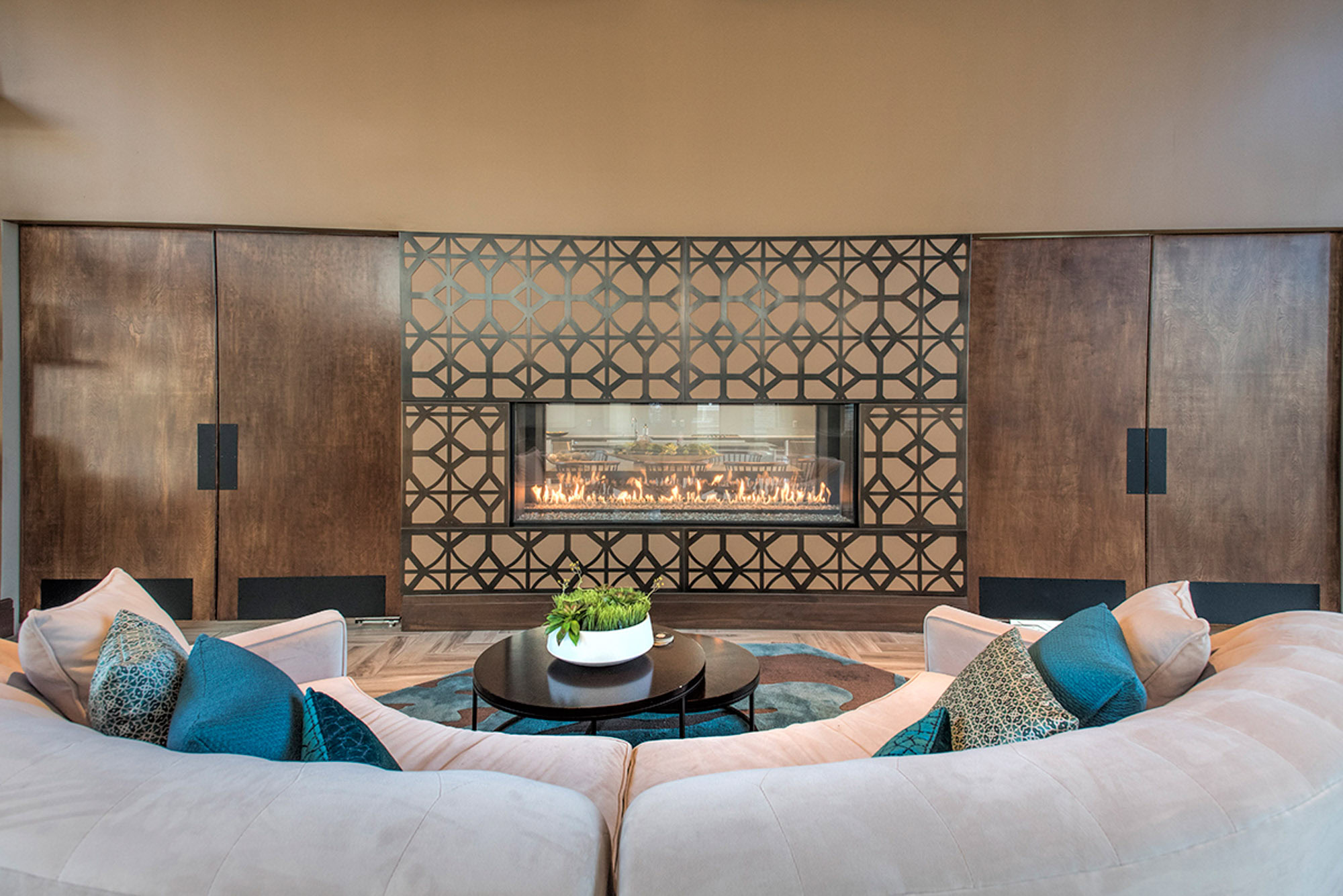 A cozy sitting area in front of a modern fireplace at the Pleasanton, CA apartments, Vintage