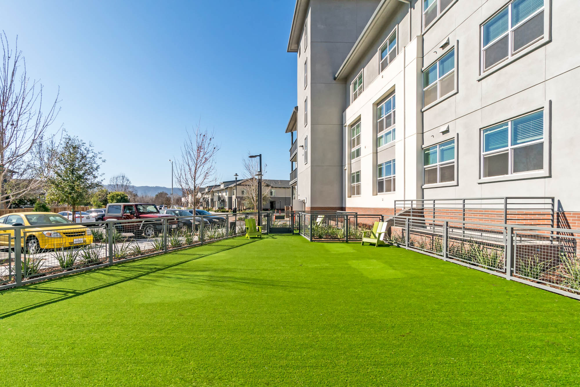 A gated dog run area with faux grass at the Vintage luxury apartments in Pleasanton, CA