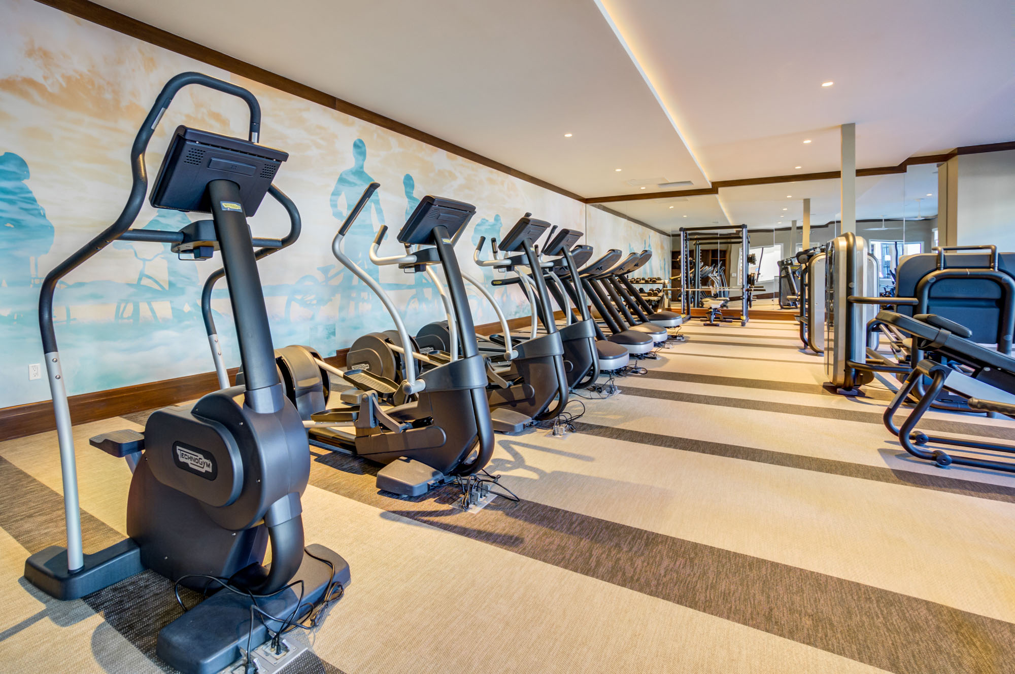 A row of fitness machines at the fitness center of the Vintage apartments in Pleasanton, CA