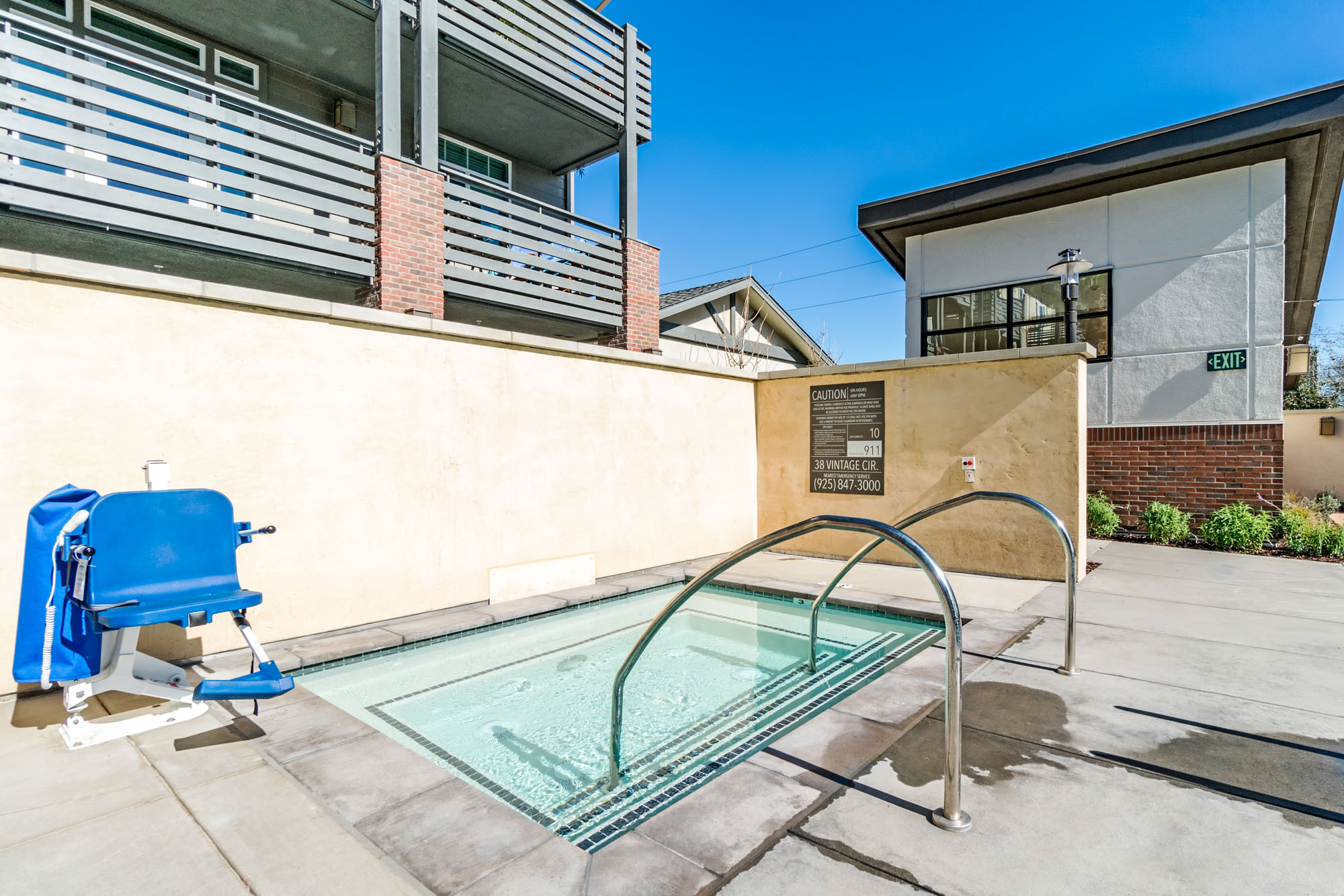 A hot tub at the Vintage apartments with an accessibility chair in Pleasanton, CA