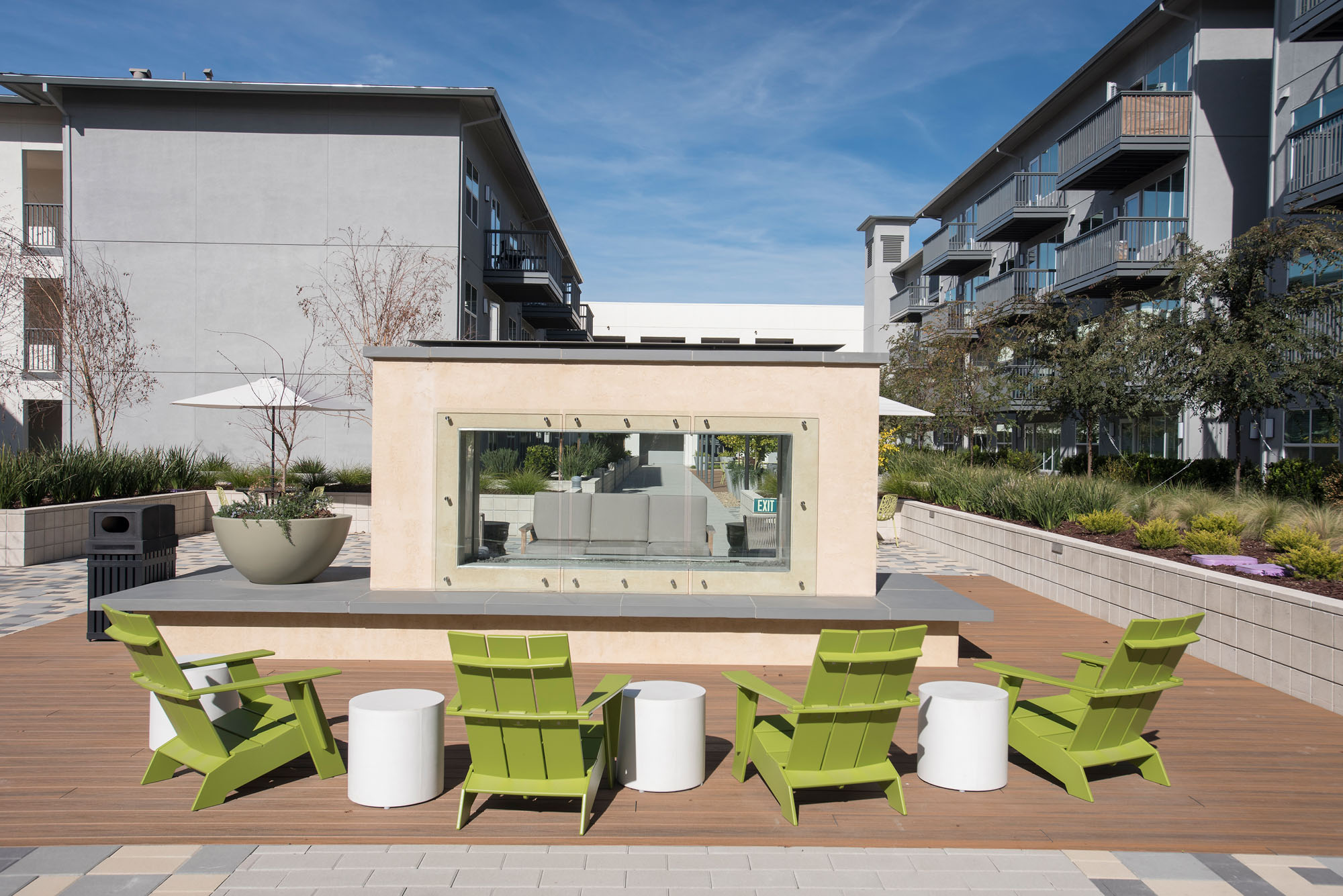 An outdoor lounging space and fireplace at the Vintage apartments in Pleasanton, CA