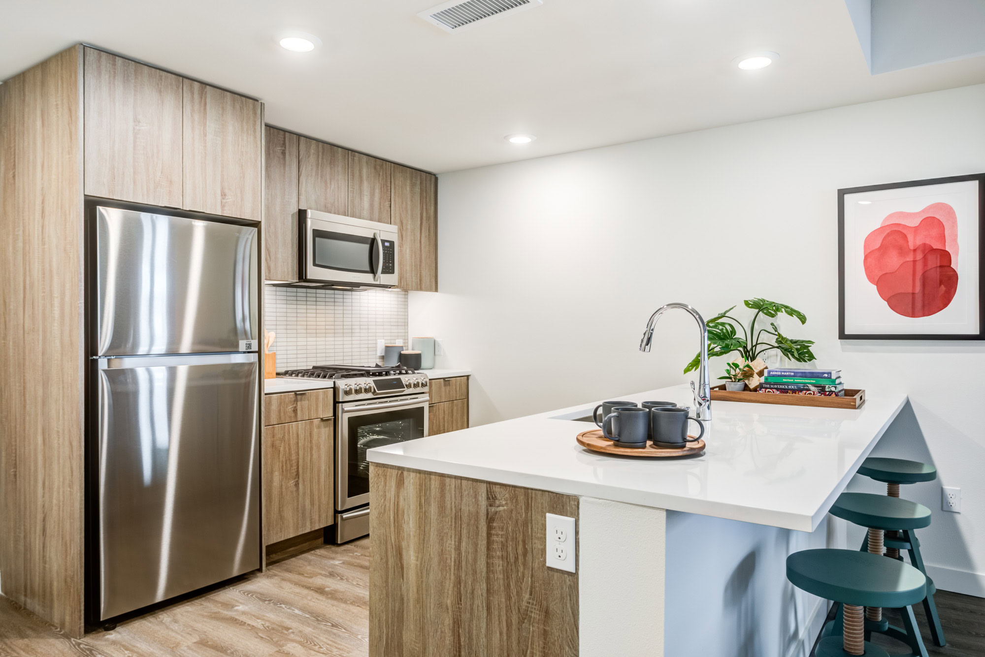 A kitchen with a peninsula at the Webster Eleven apartments in downtown Oakland
