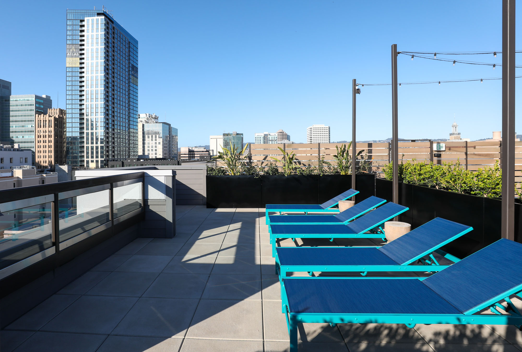 Pool lounging chairs on the rooftop of the Webster Eleven apartments in downtown oakland