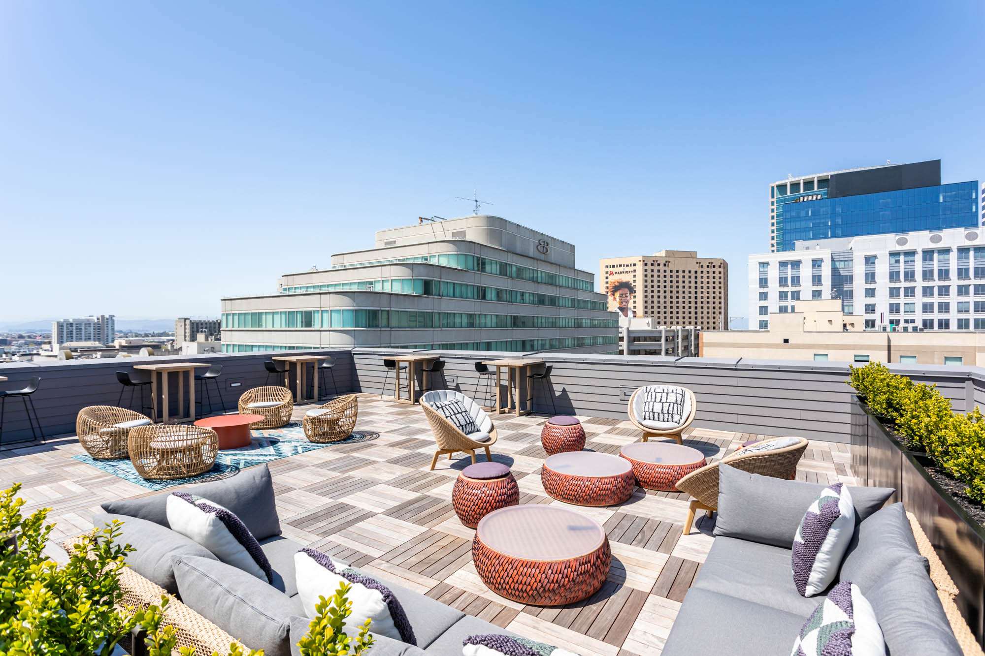 A rooftop lounge with 360 views of the city skyline at Webster Eleven apartments in downtown Oakland