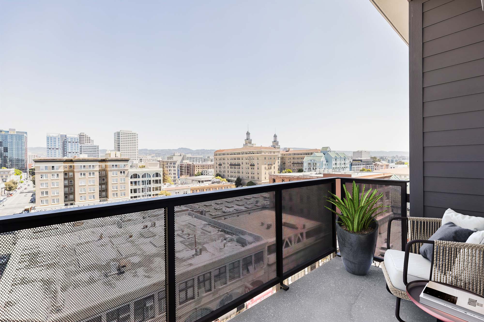 A balcony overlooking the city in an apartment at the Webster Eleven apartments in downtown Oakland
