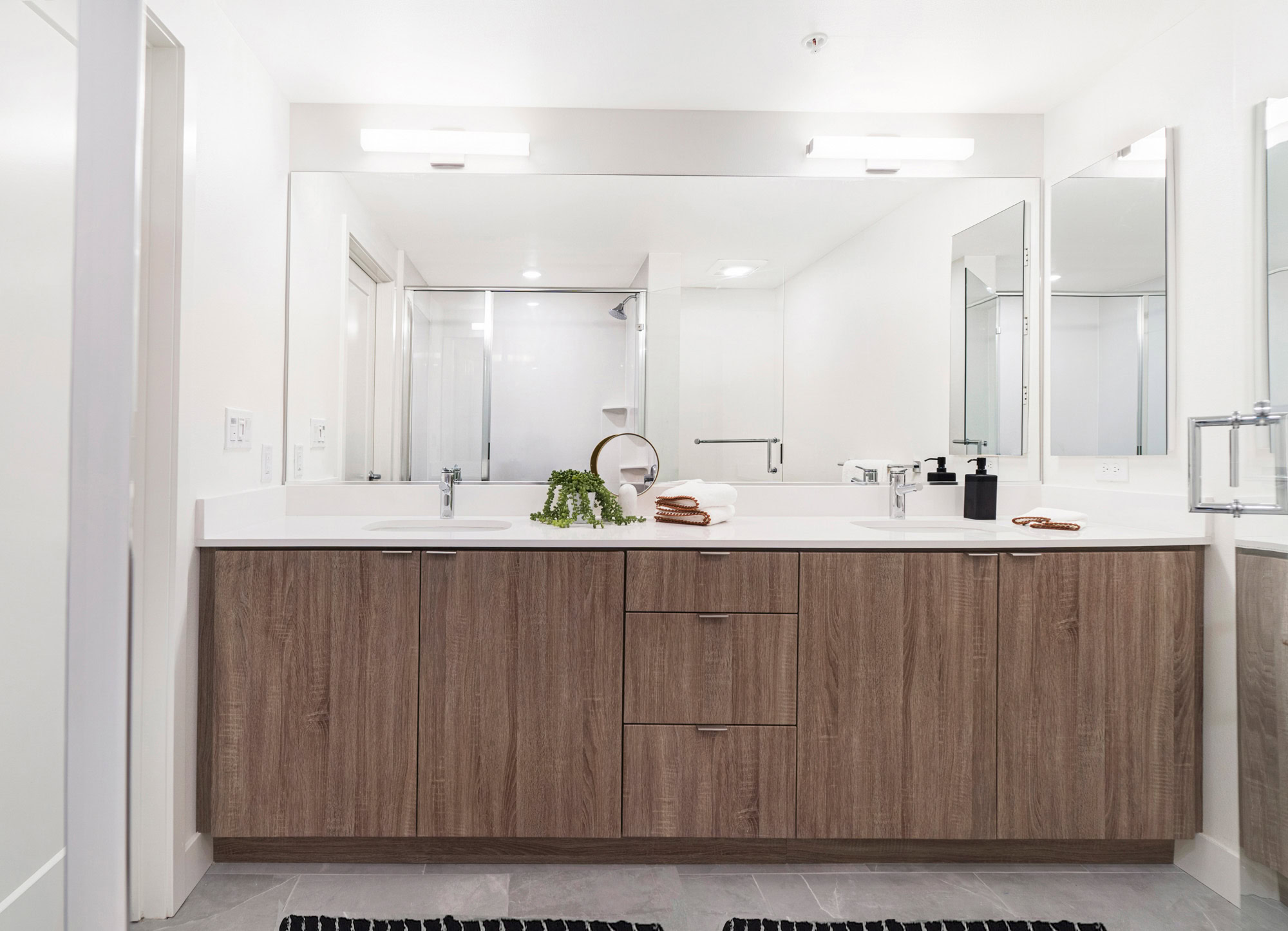 A spa-like, double sink bathroom vanity at a Webster Eleven downtown Oakland apartment for rent