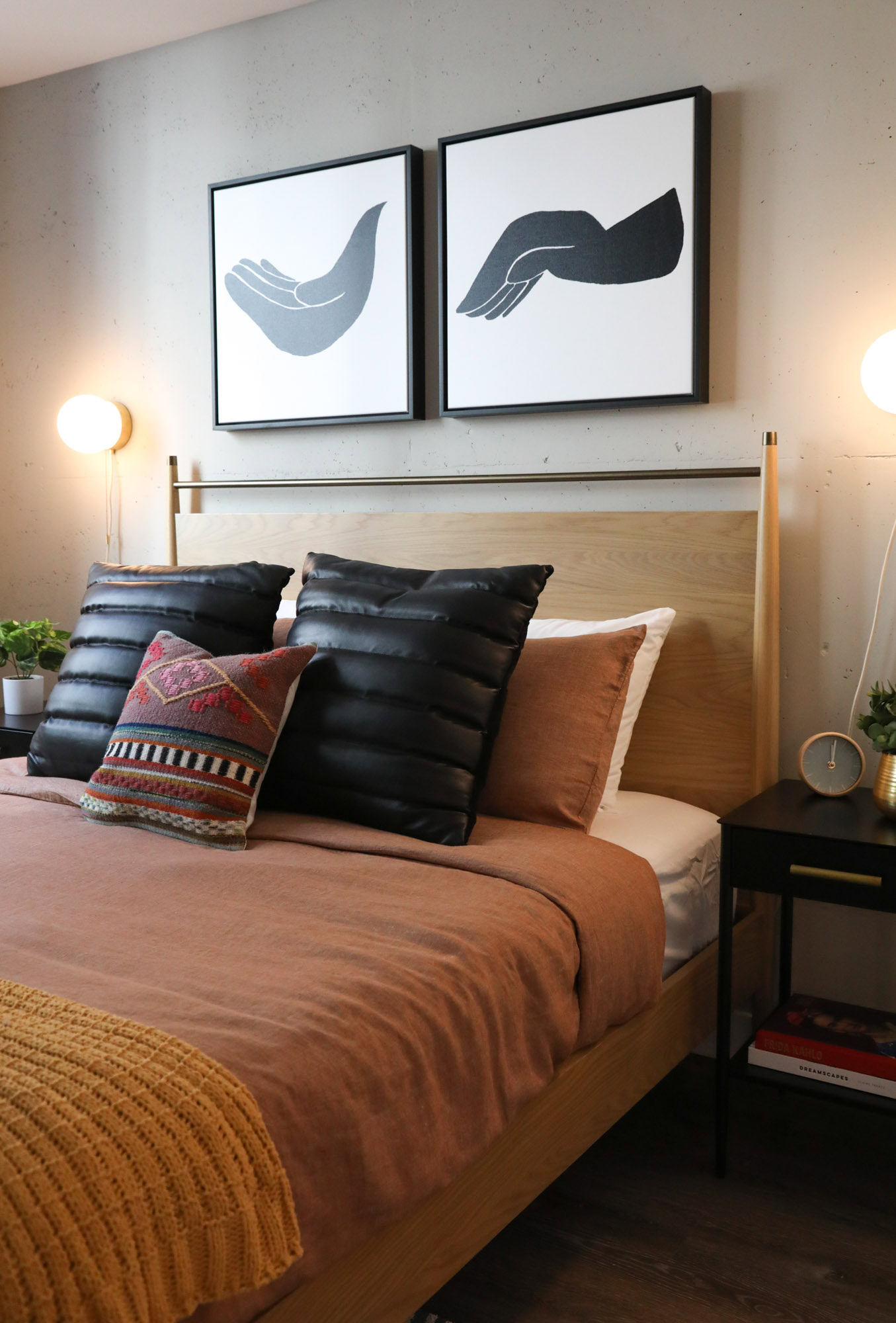 A bedroom with hardwood floors at the Webster Eleven apartments for rent in downtown Oakland