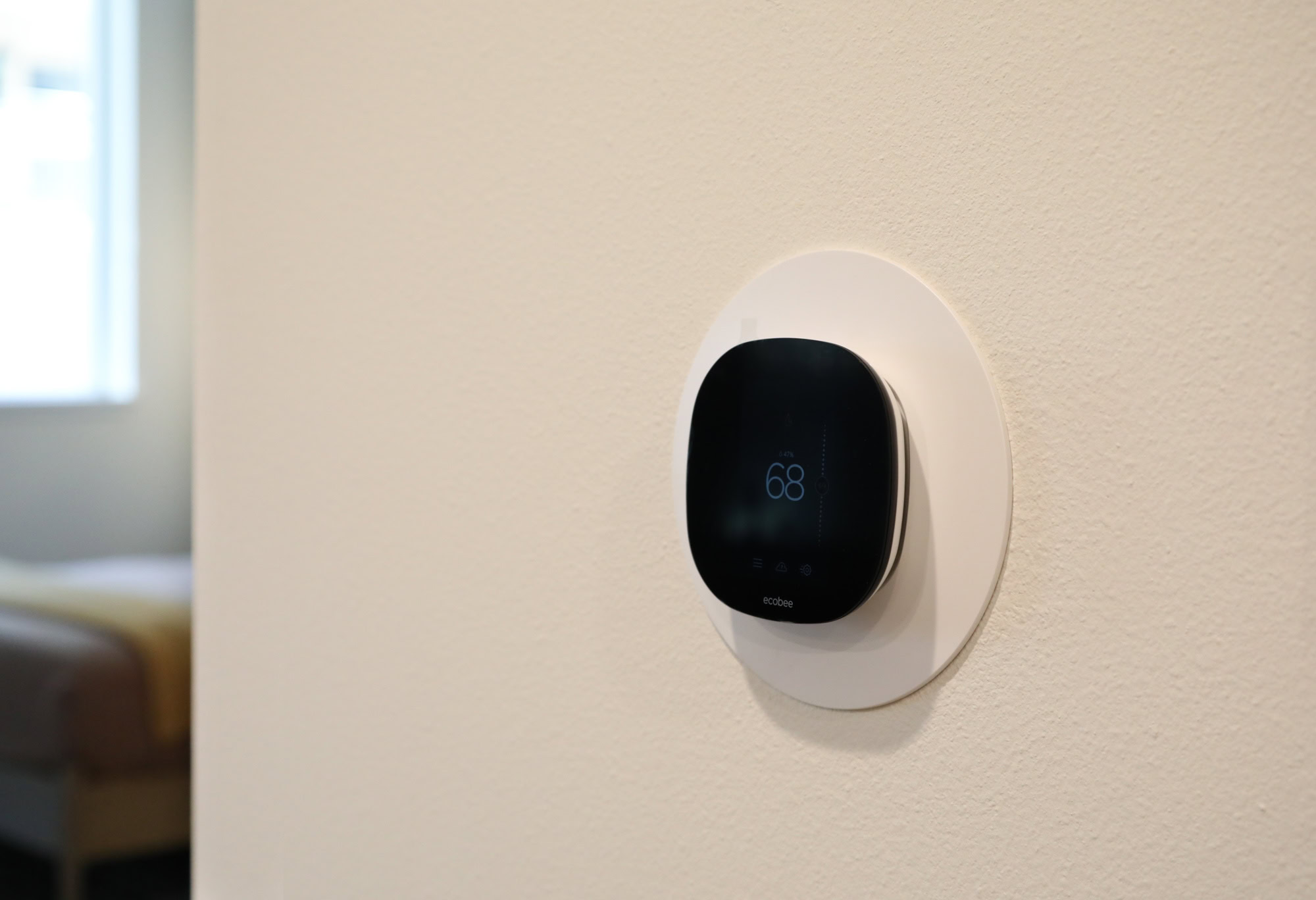 A modern thermostat in the living room area of the Webster Eleven apartments in downtown Oakland