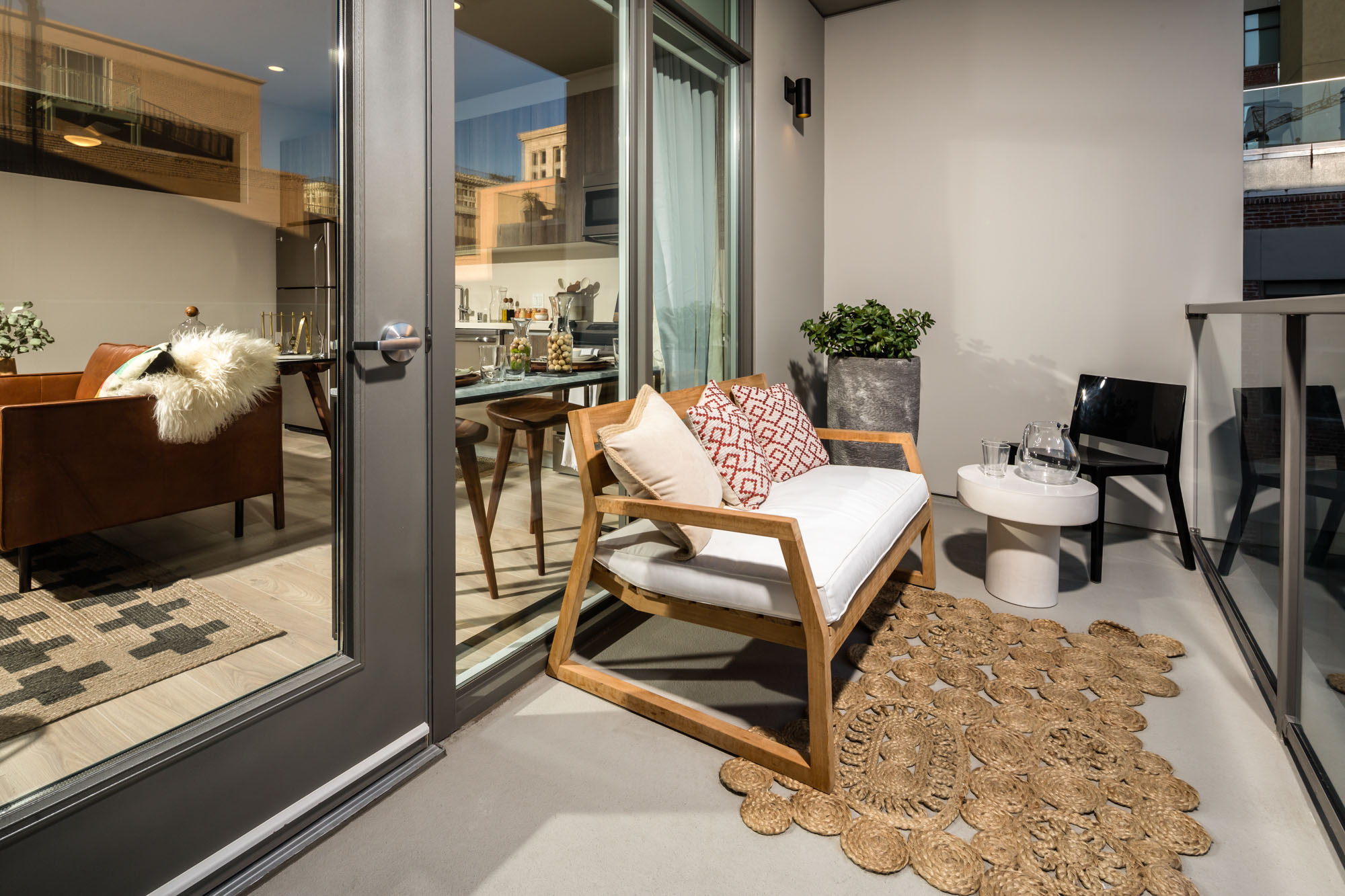 Furnished 8th and Grand apartment balcony and a glass door leading to the luxury Downtown LA apartment